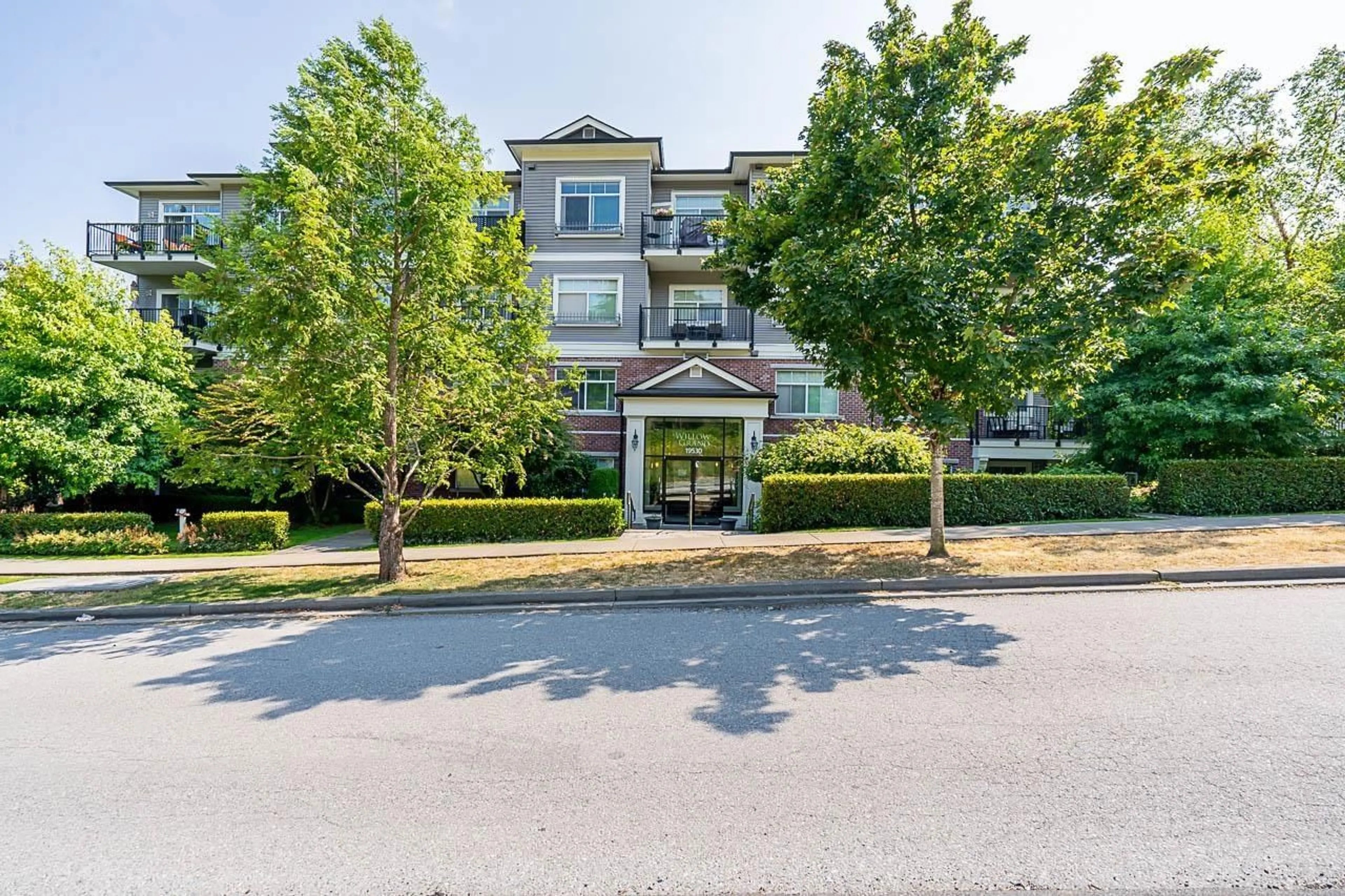 A pic from outside/outdoor area/front of a property/back of a property/a pic from drone, unknown for 101 - 19530 65, Surrey British Columbia V4N6M1