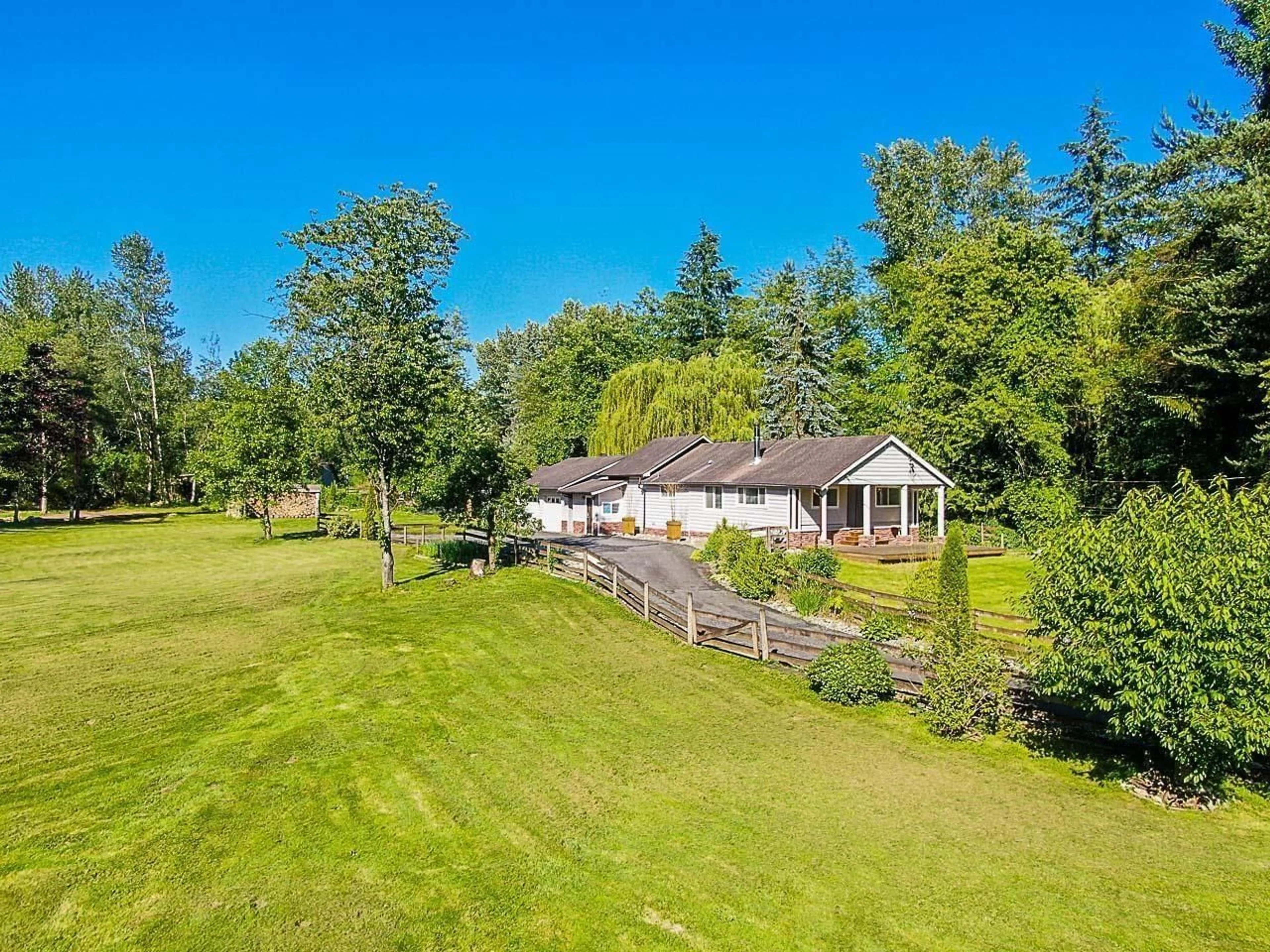 A pic from outside/outdoor area/front of a property/back of a property/a pic from drone, water/lake/river/ocean view for 25887 60, Langley British Columbia V4W1L3