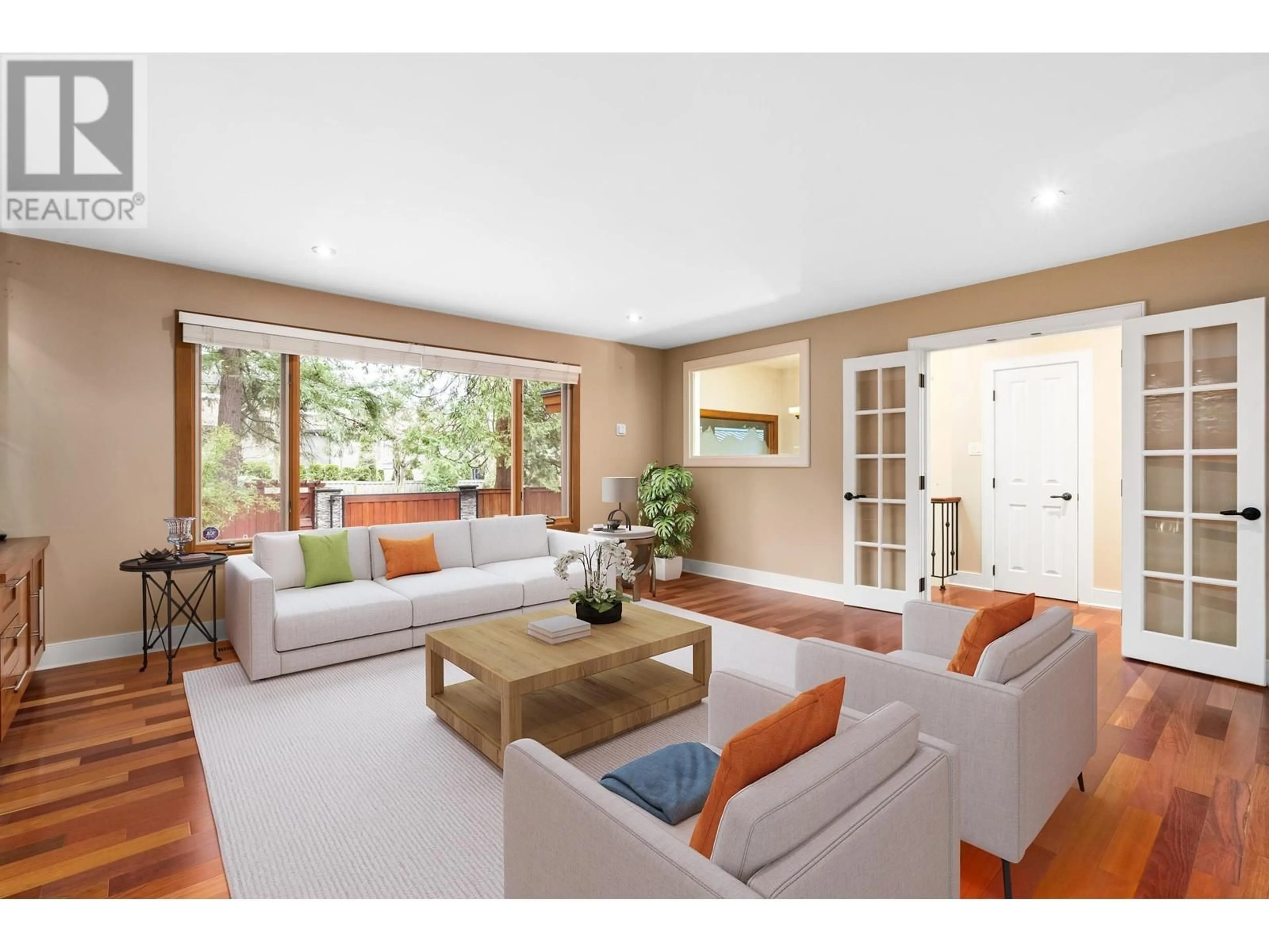 Living room with furniture, wood/laminate floor for 4793 CAPILANO ROAD, North Vancouver British Columbia V7R4K2