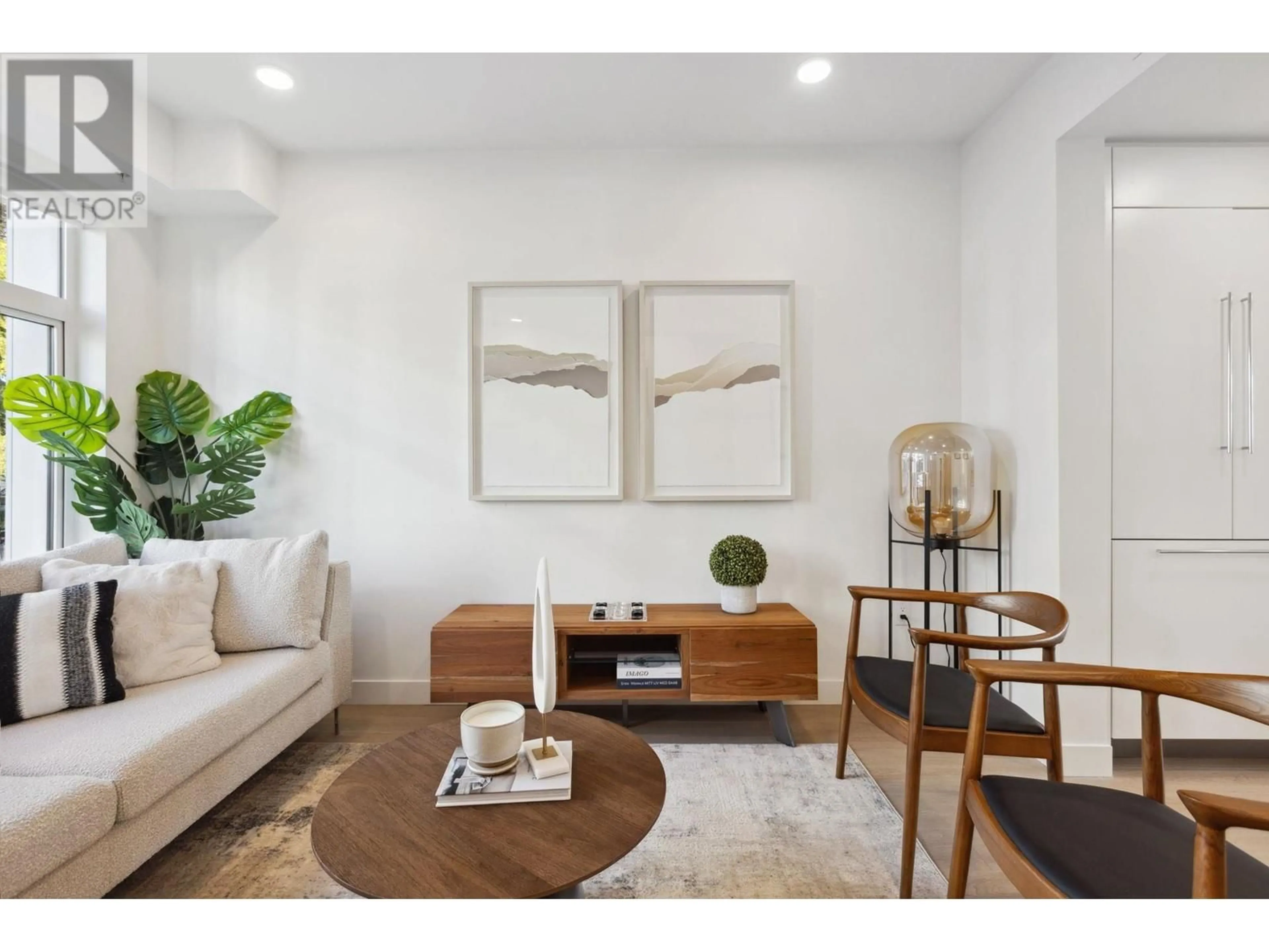 Living room with furniture, wood/laminate floor for 213 - 1008 47TH AVENUE, Vancouver British Columbia V6M0E3