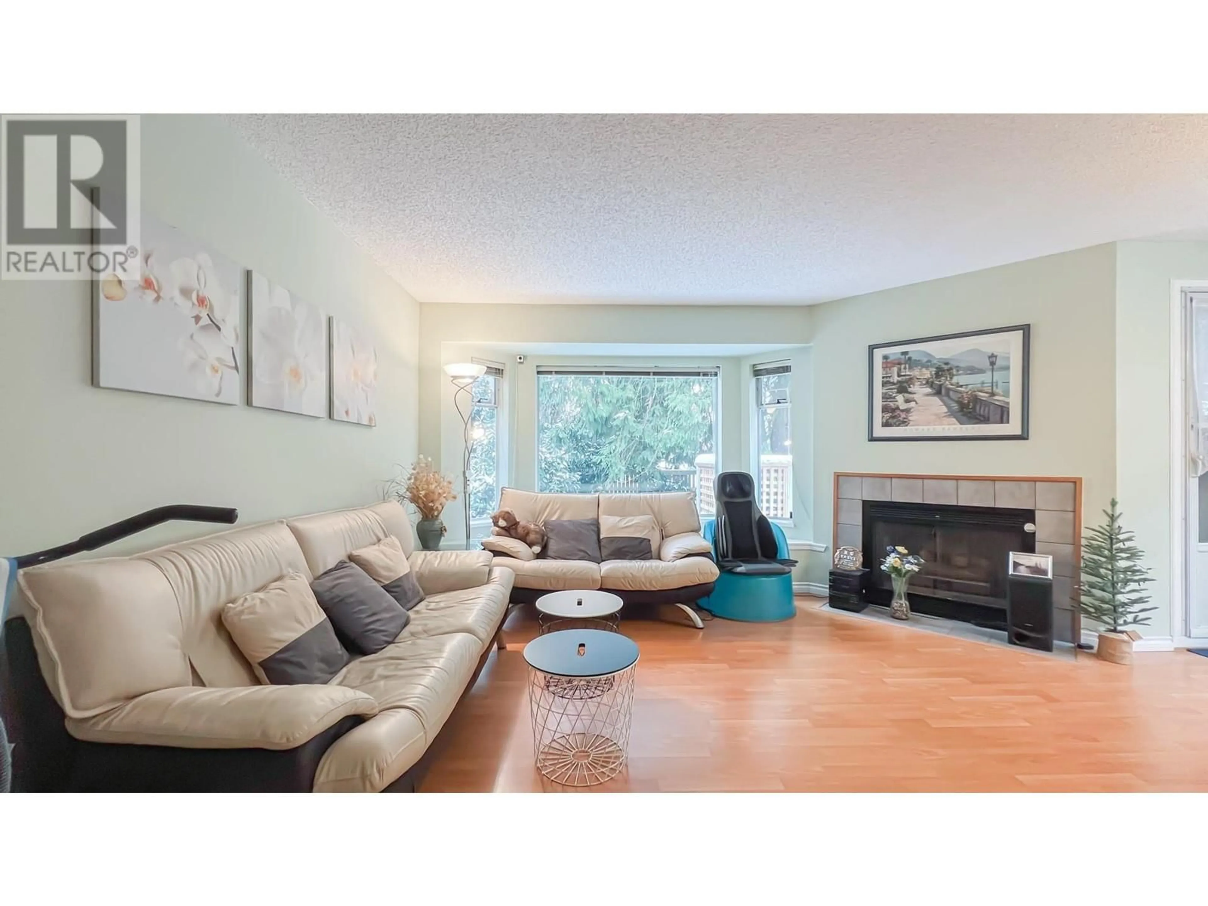 Living room with furniture, wood/laminate floor for 3111 SADDLE LANE, Vancouver British Columbia V5S4L4