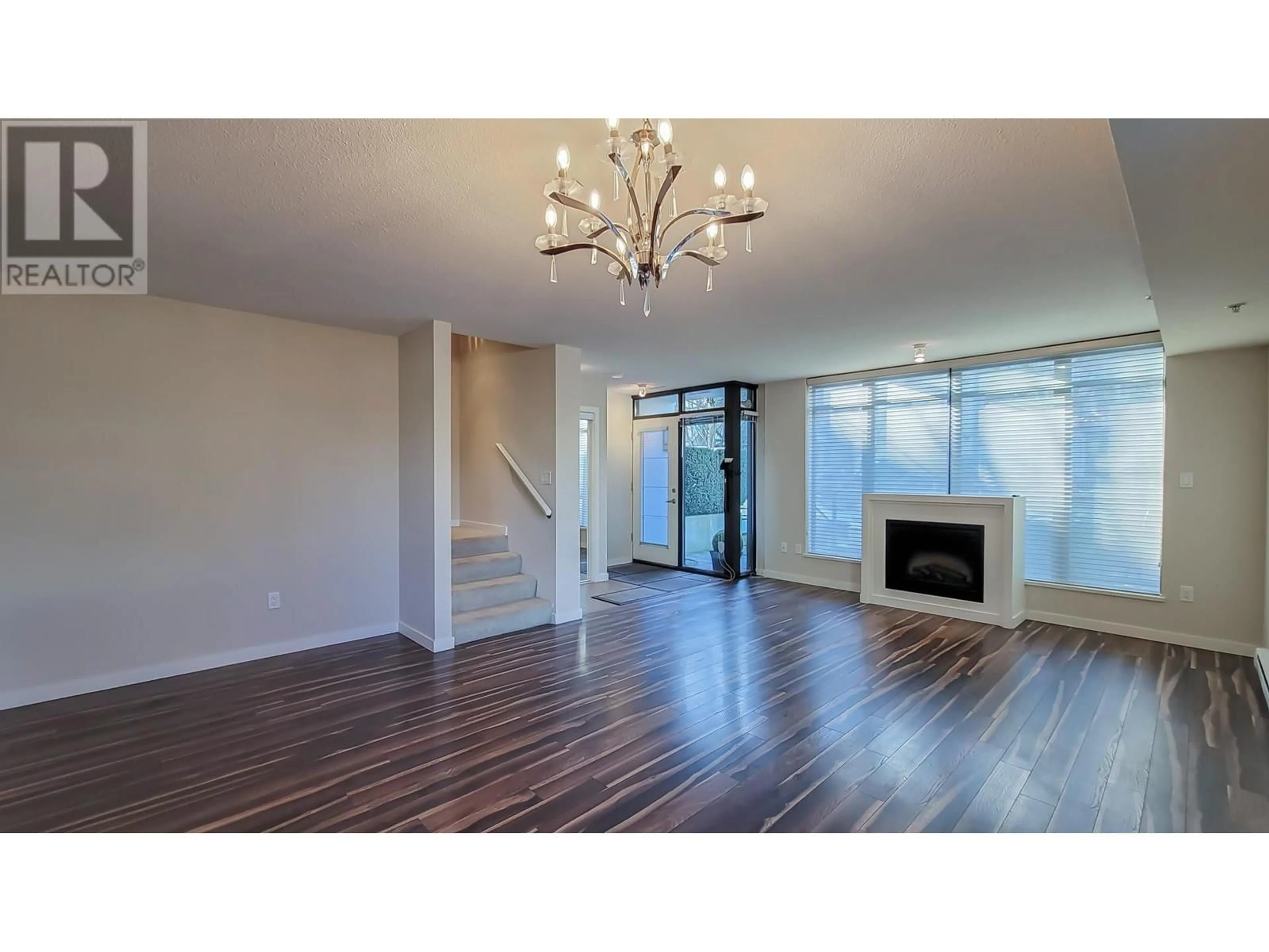 Living room with furniture, wood/laminate floor for 1191 THE HIGH STREET, Coquitlam British Columbia V3B0B1