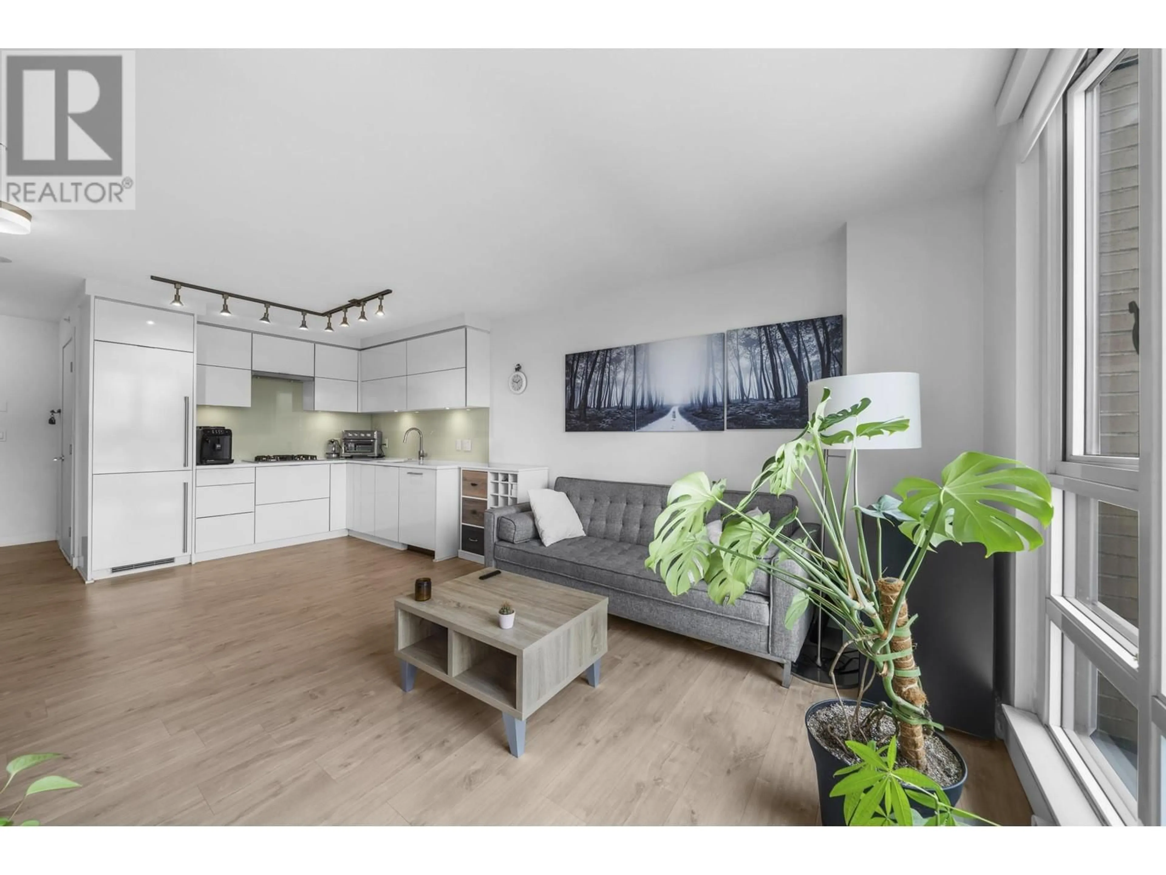 Living room with furniture, wood/laminate floor for 210 - 238 BROADWAY, Vancouver British Columbia V5Y0L2
