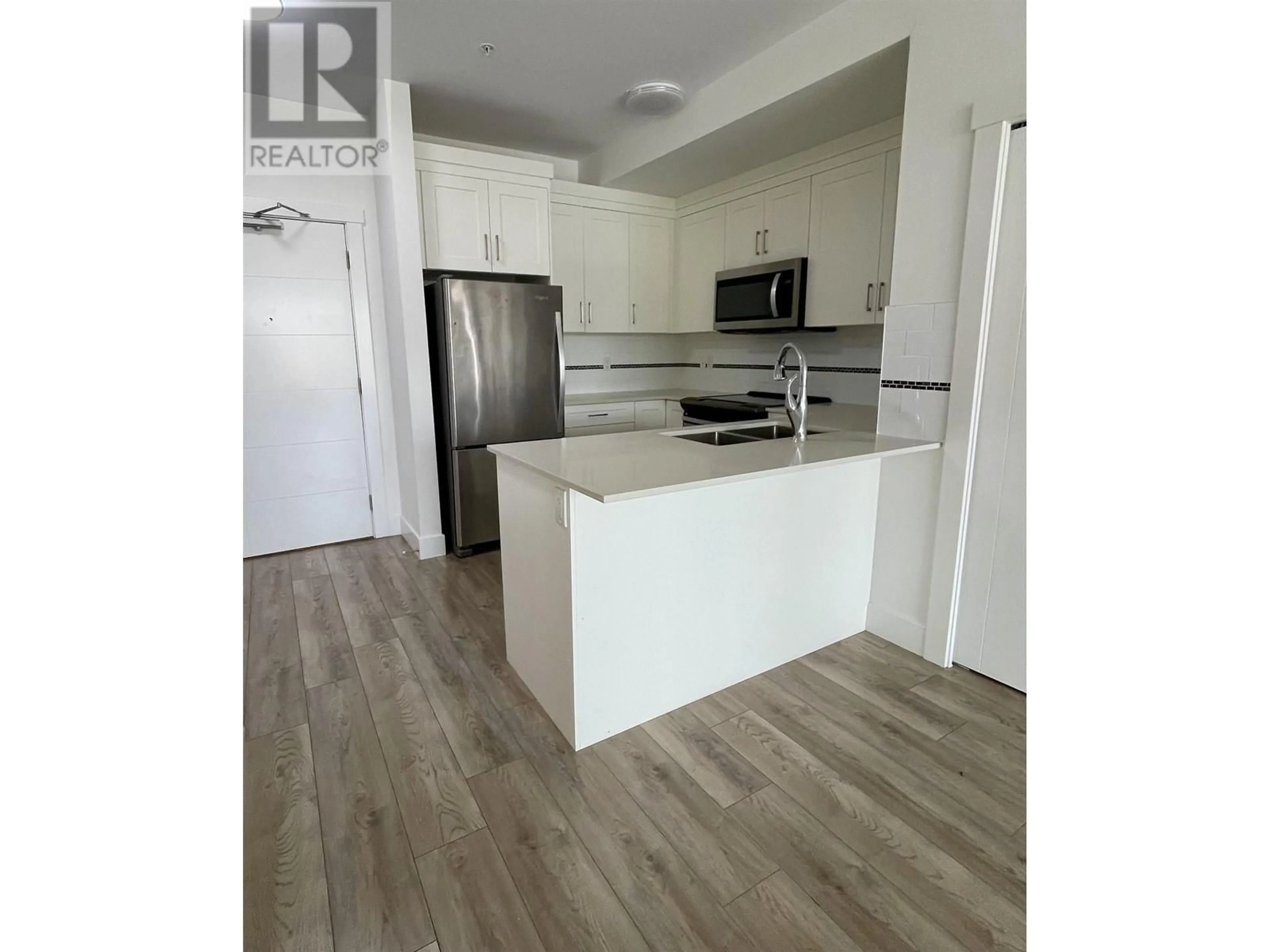 Open concept kitchen, wood/laminate floor for 301 22577 ROYAL CRESCENT, Maple Ridge British Columbia V2X2M2