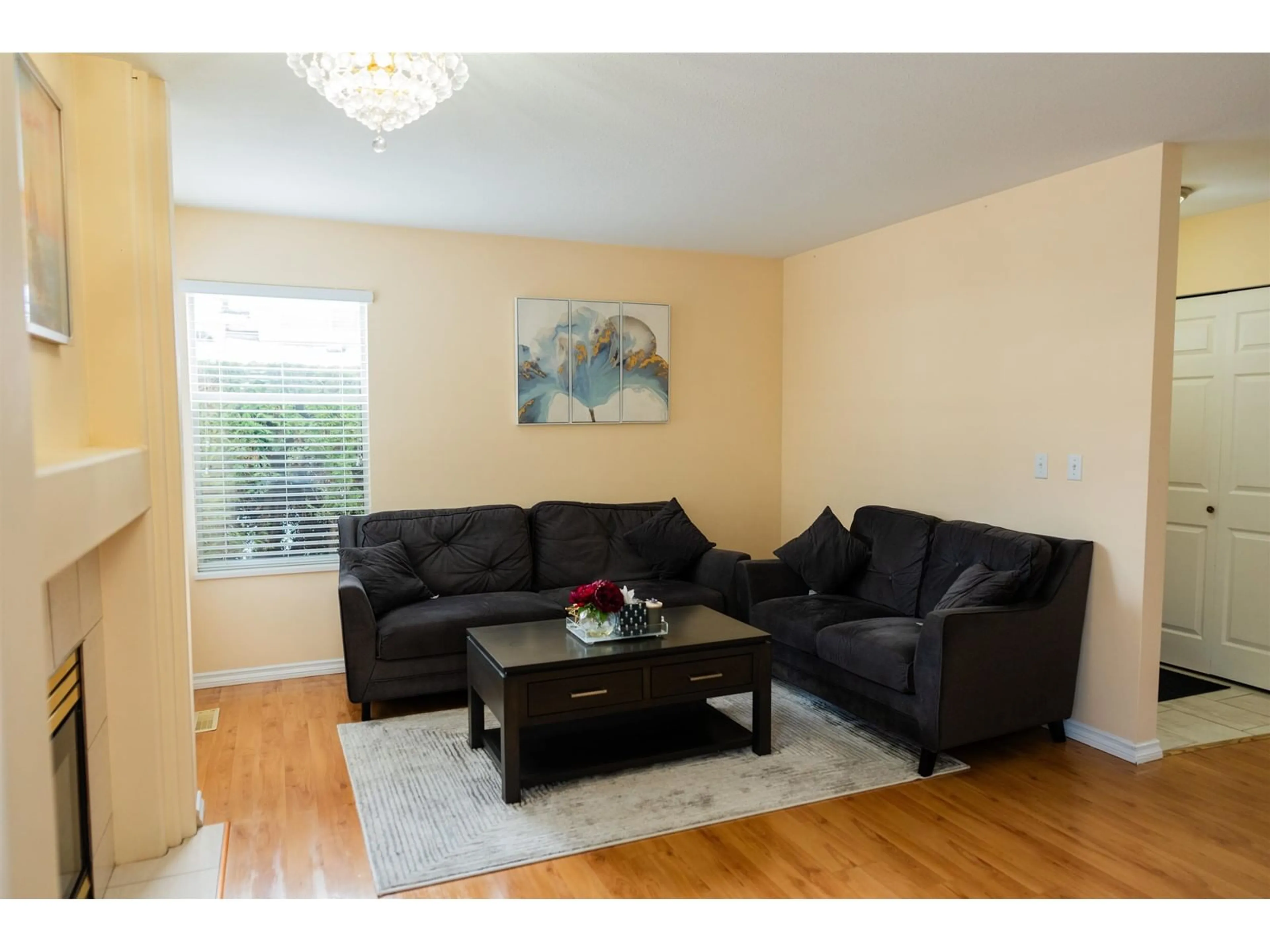 Living room with furniture, wood/laminate floor for 30 - 7140 132, Surrey British Columbia V3W1J5