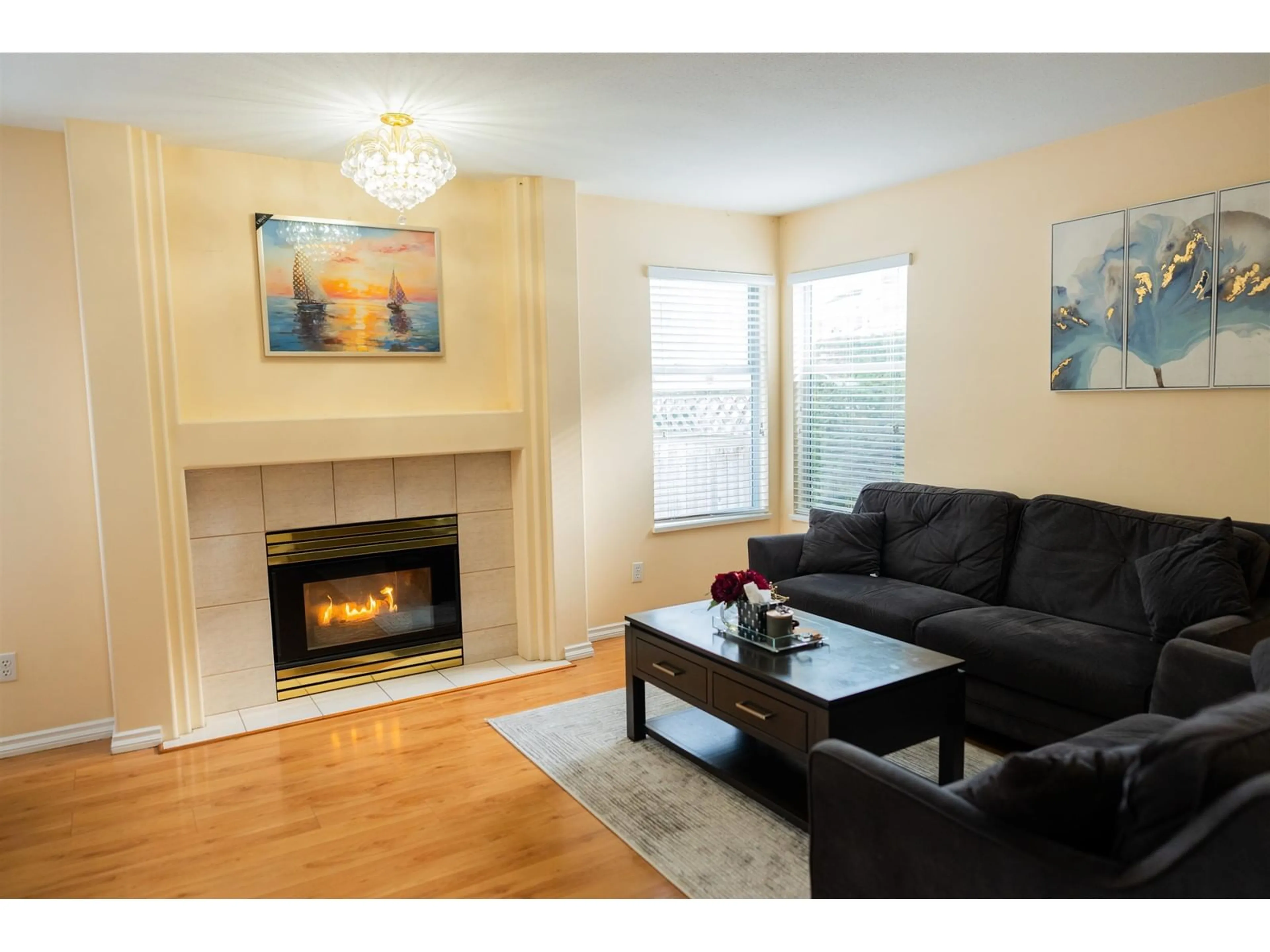 Living room with furniture, wood/laminate floor for 30 - 7140 132, Surrey British Columbia V3W1J5