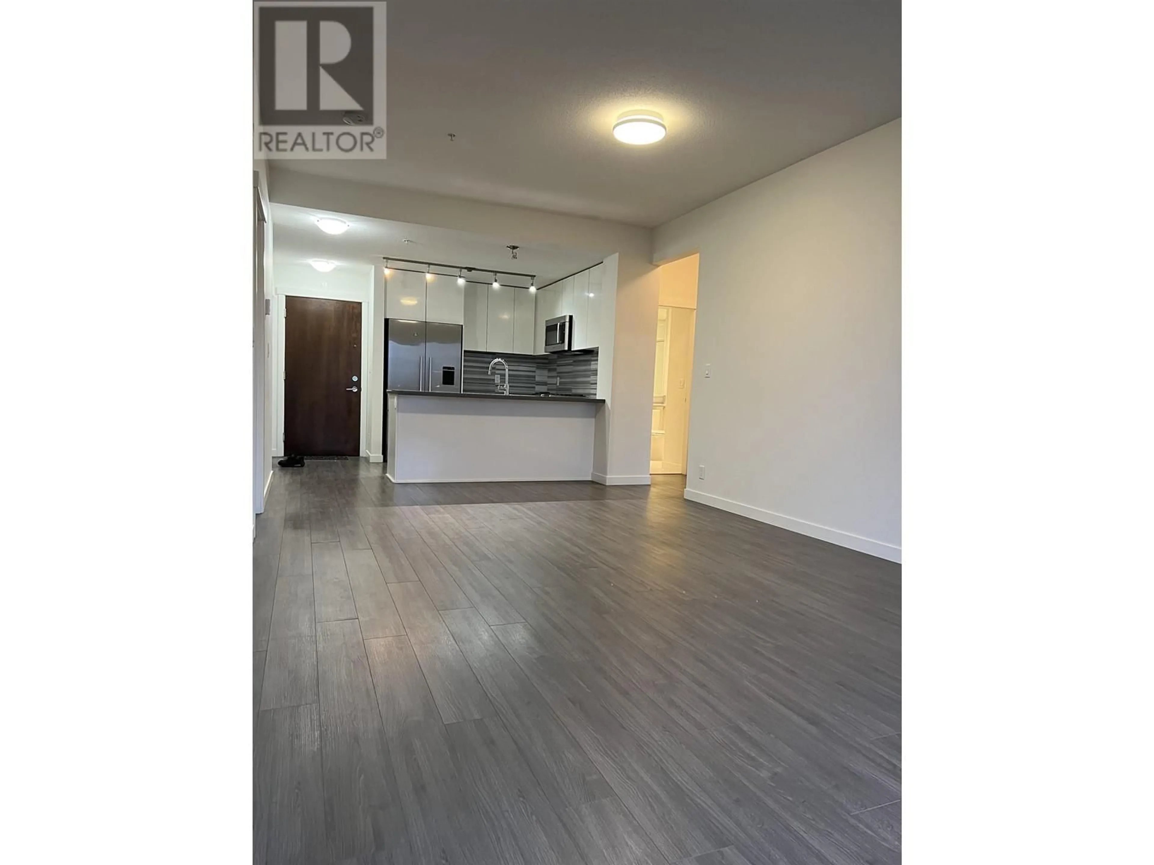 Open concept kitchen, wood/laminate floor for 203 3138 RIVERWALK AVENUE, Vancouver British Columbia V5S0B6