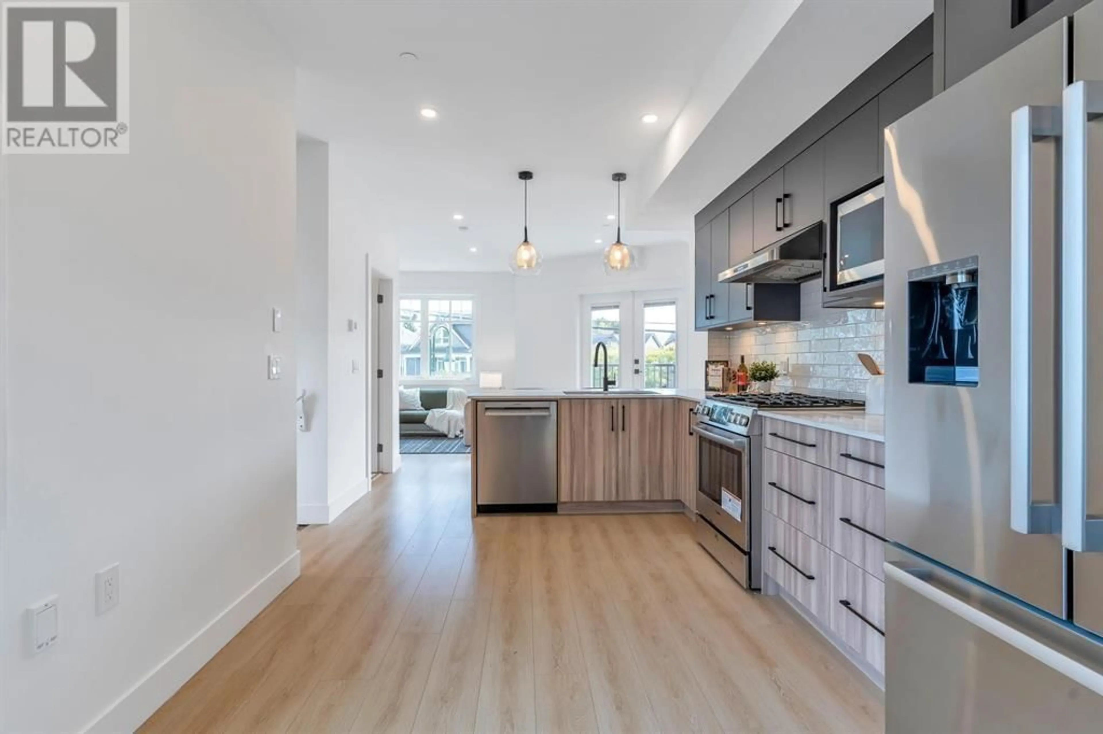 Open concept kitchen, wood/laminate floor for 4 - 4829 48 AVENUE, Ladner British Columbia V4K1V2