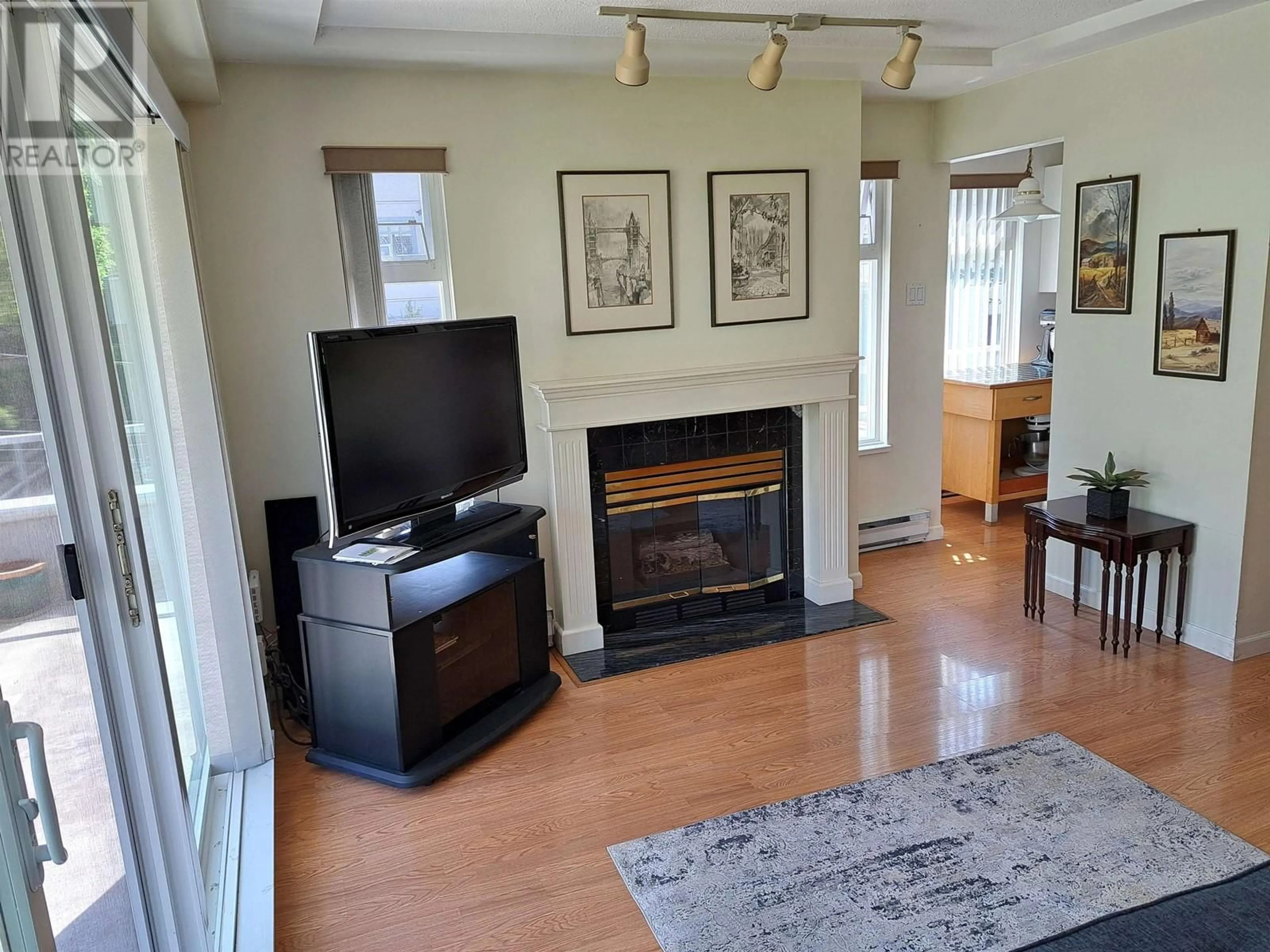 Living room with furniture, wood/laminate floor for #207 865 W 15TH AVENUE, Vancouver British Columbia V5Z1R8