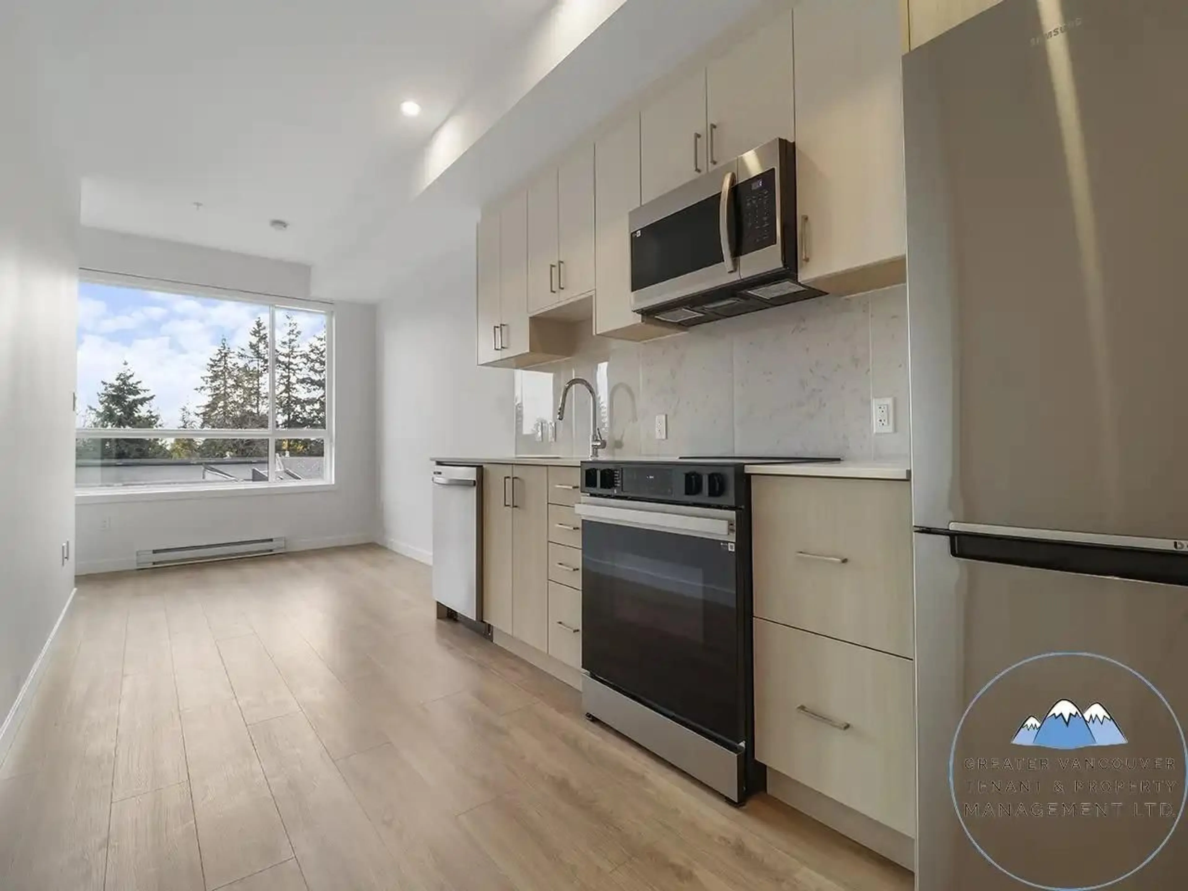 Open concept kitchen, wood/laminate floor for W205 13838 108 AVENUE, Surrey British Columbia V3T0T8