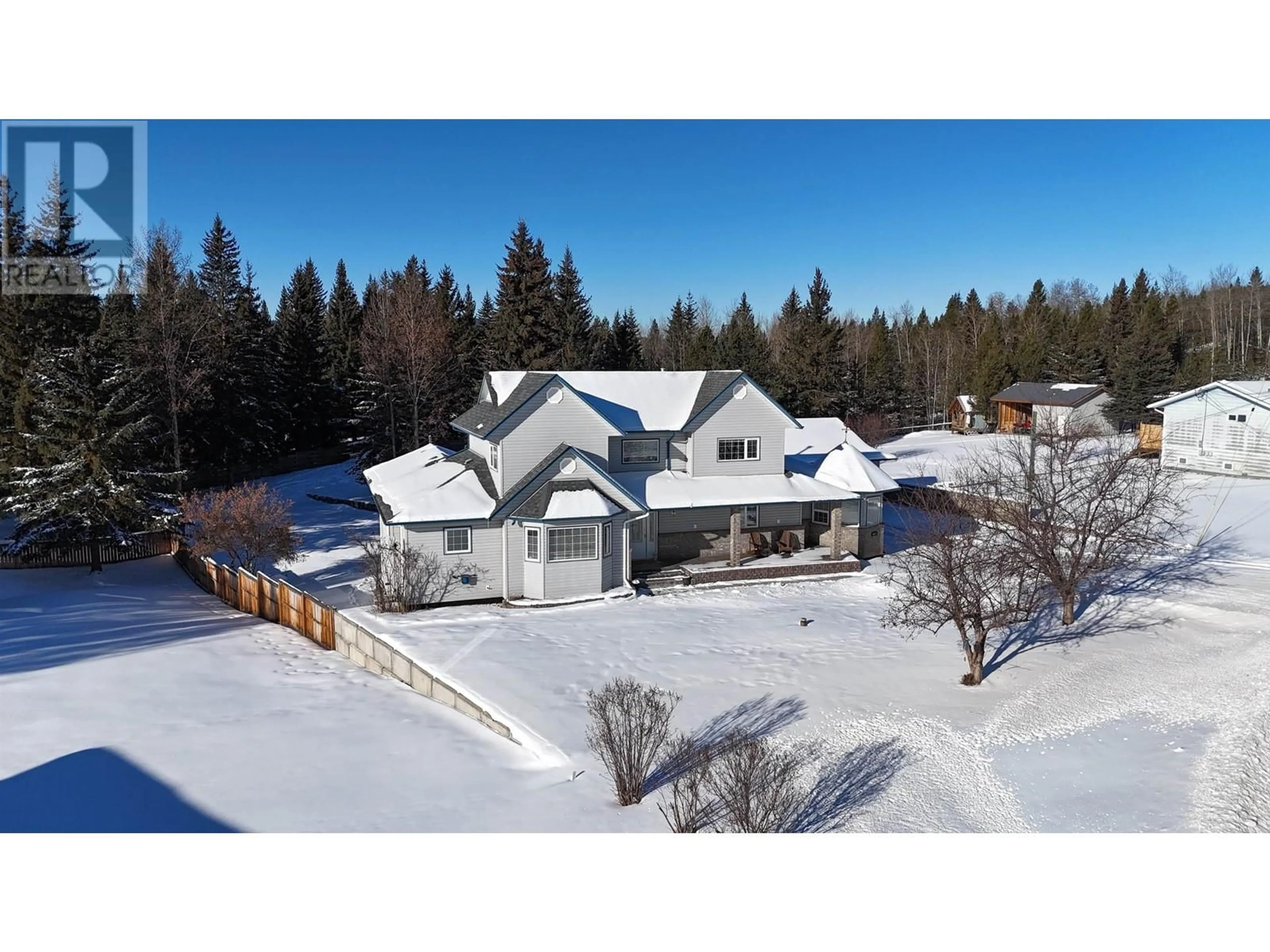 A pic from outside/outdoor area/front of a property/back of a property/a pic from drone, mountain view for 6517 GREY CRESCENT, 100 Mile House British Columbia V0K2E3