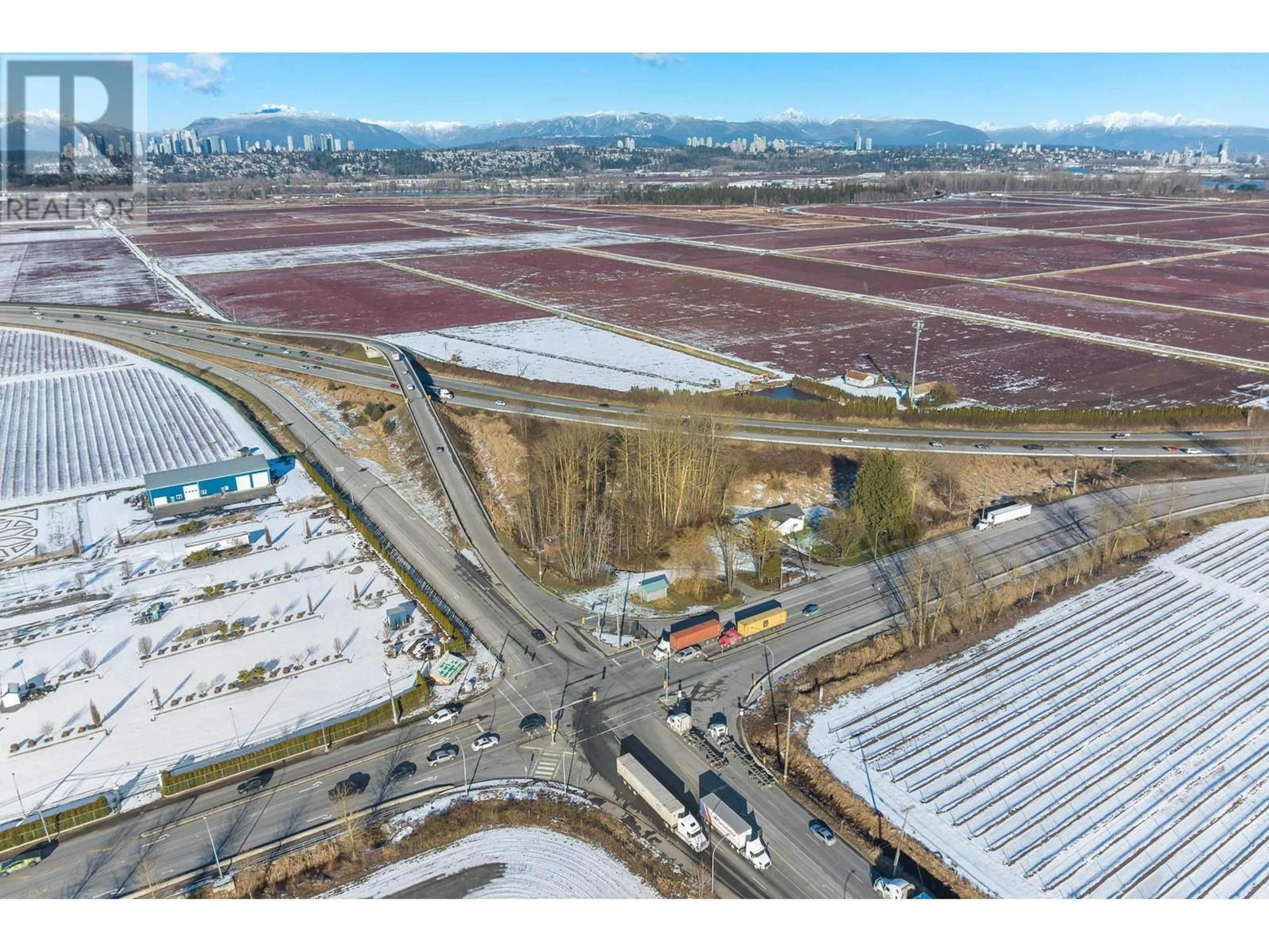 A pic from outside/outdoor area/front of a property/back of a property/a pic from drone, mountain view for 19051-19191 WESTMINSTER HIGHWAY, Richmond British Columbia V6V1B2