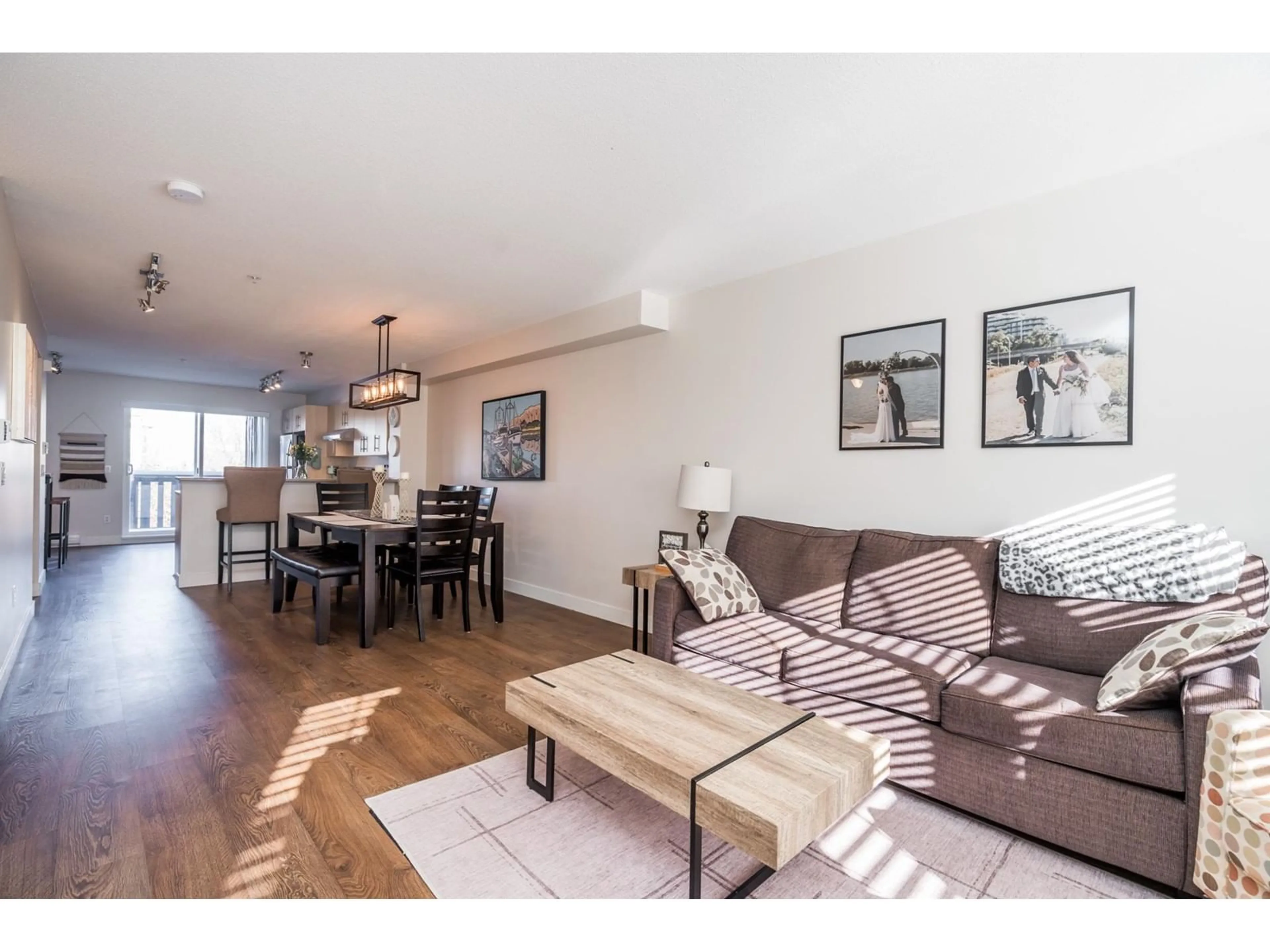 Living room with furniture, wood/laminate floor for 146 20875 80 AVENUE, Langley British Columbia V2Y0B2