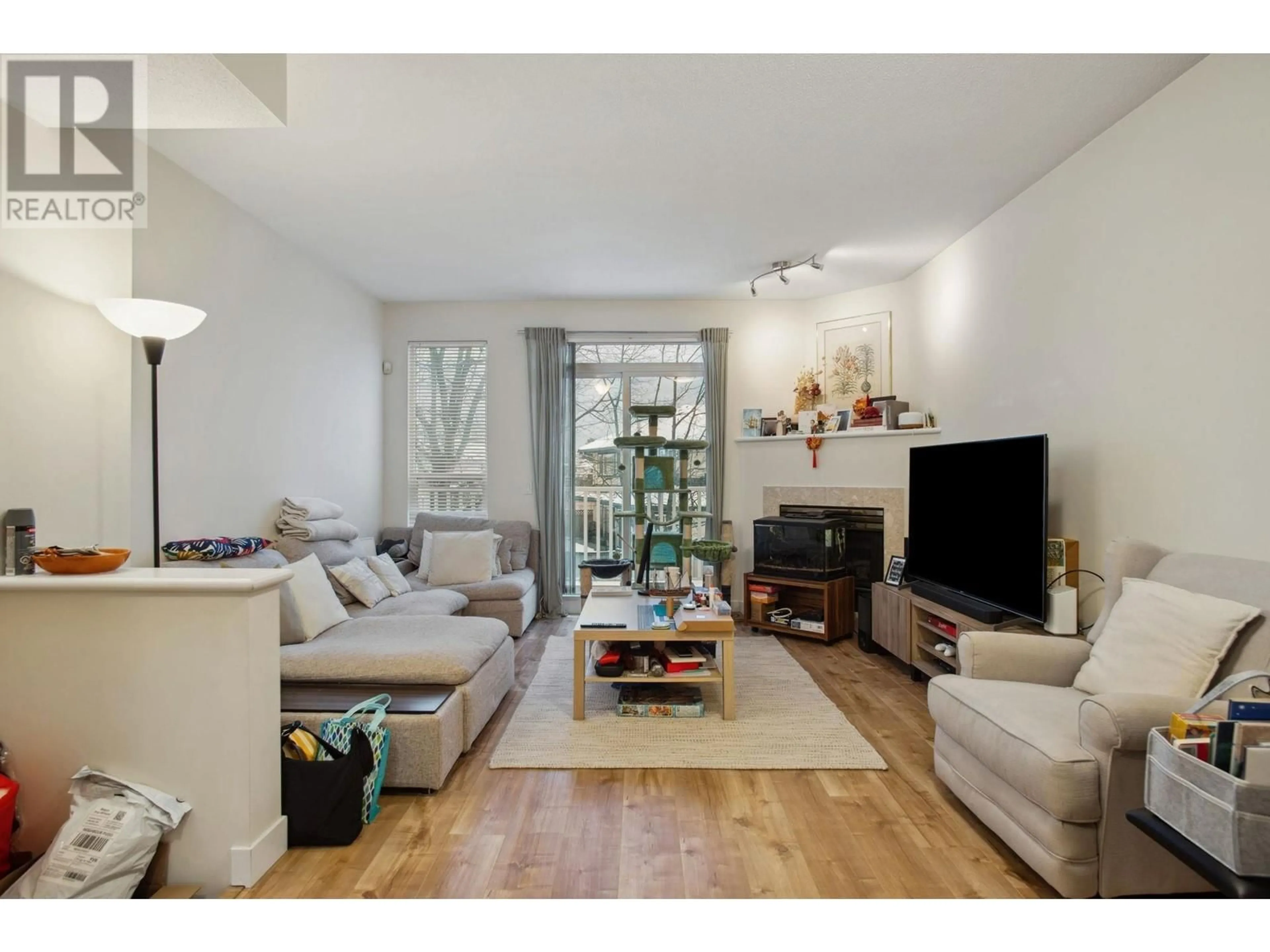 Living room with furniture, wood/laminate floor for 48 12311 MCNEELY DRIVE, Richmond British Columbia V6V2S2