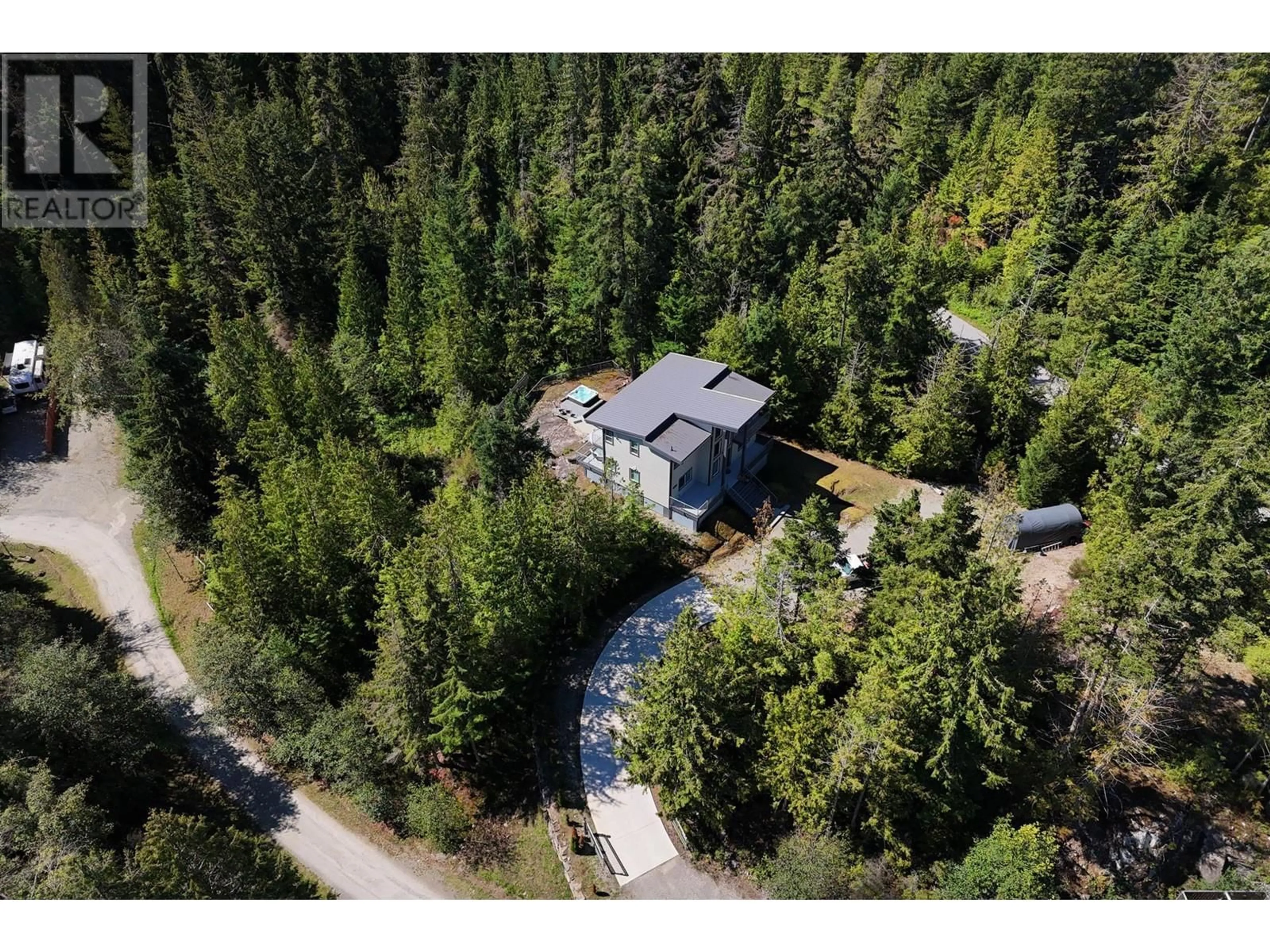 A pic from outside/outdoor area/front of a property/back of a property/a pic from drone, forest/trees view for 9431 STEPHENS WAY, Halfmoon Bay British Columbia V0N1Y2