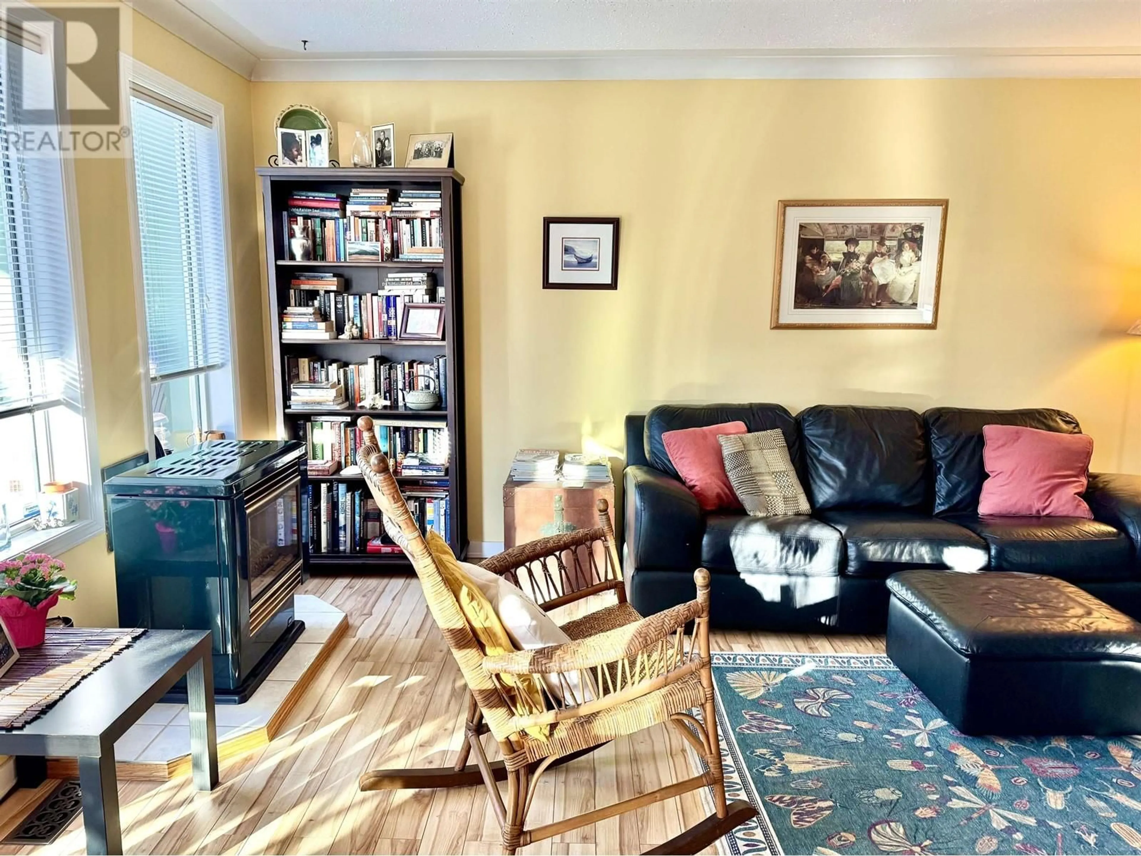 Living room with furniture, wood/laminate floor for 4235 ASTLAIS PLACE, Smithers British Columbia V0J2N0