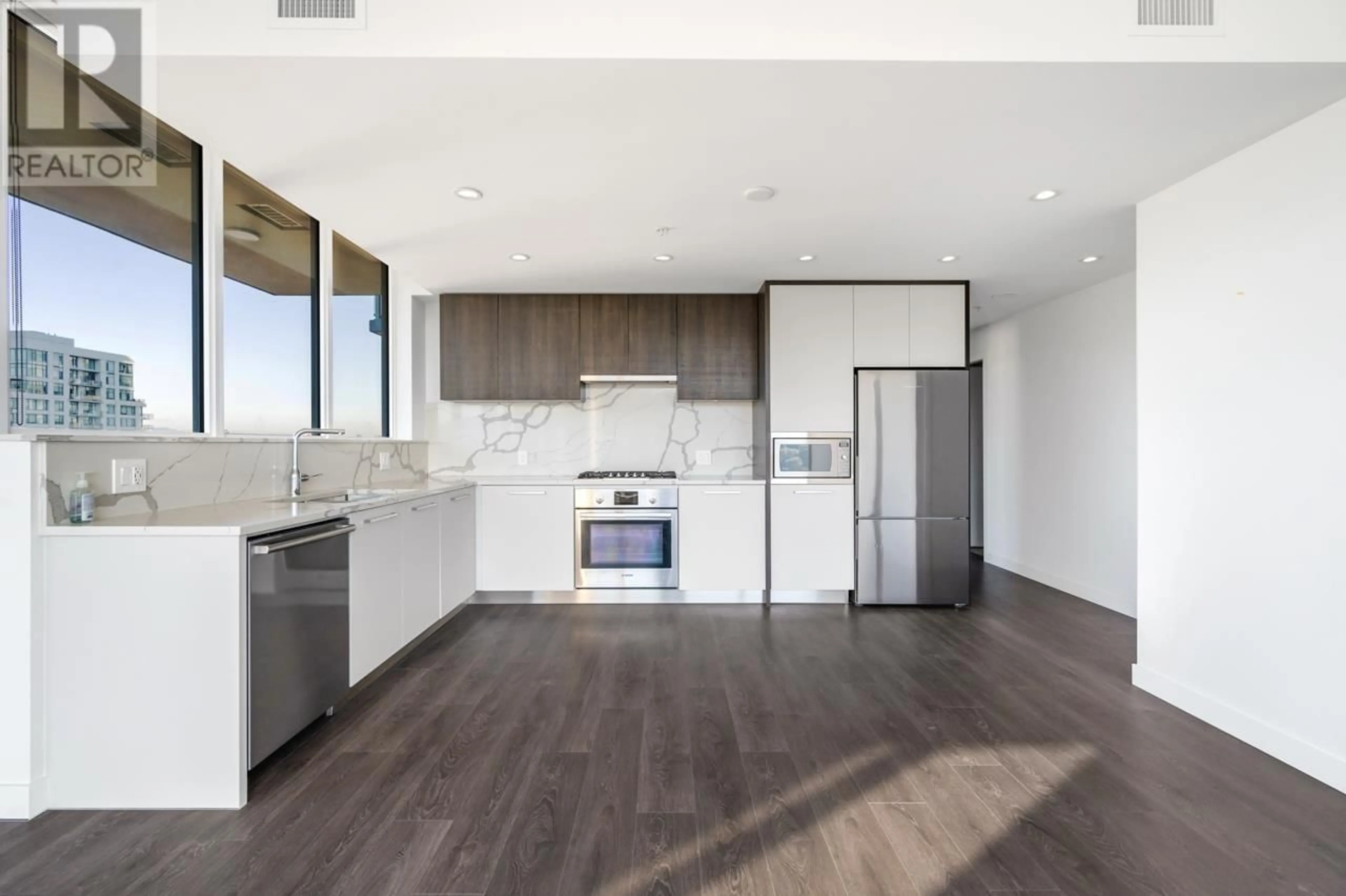 Open concept kitchen, wood/laminate floor for 1904 - 567 CLARKE ROAD, Coquitlam British Columbia V3J0K7