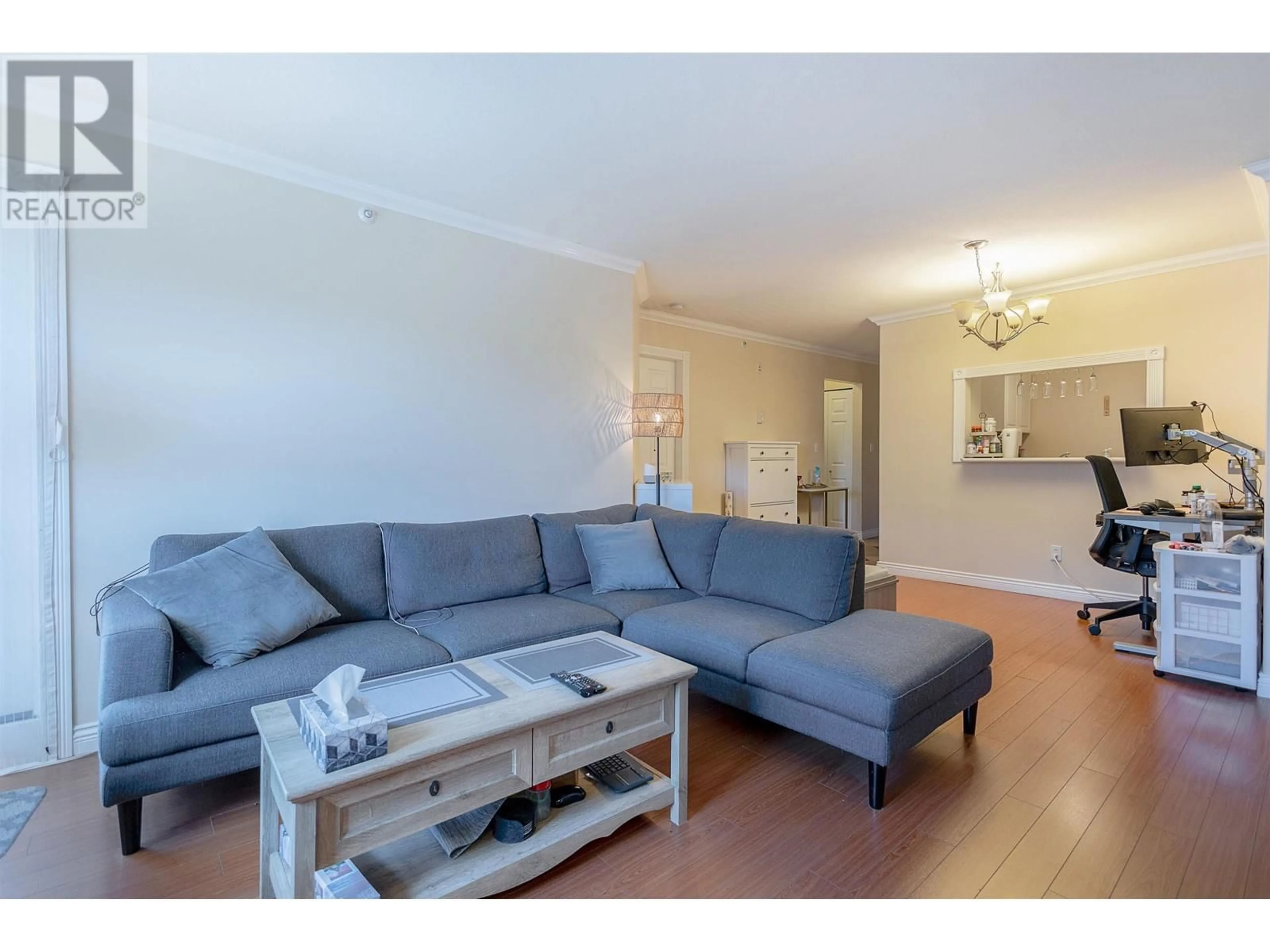 Living room with furniture, wood/laminate floor for PH8 2405 KAMLOOPS STREET, Vancouver British Columbia V5M4V6