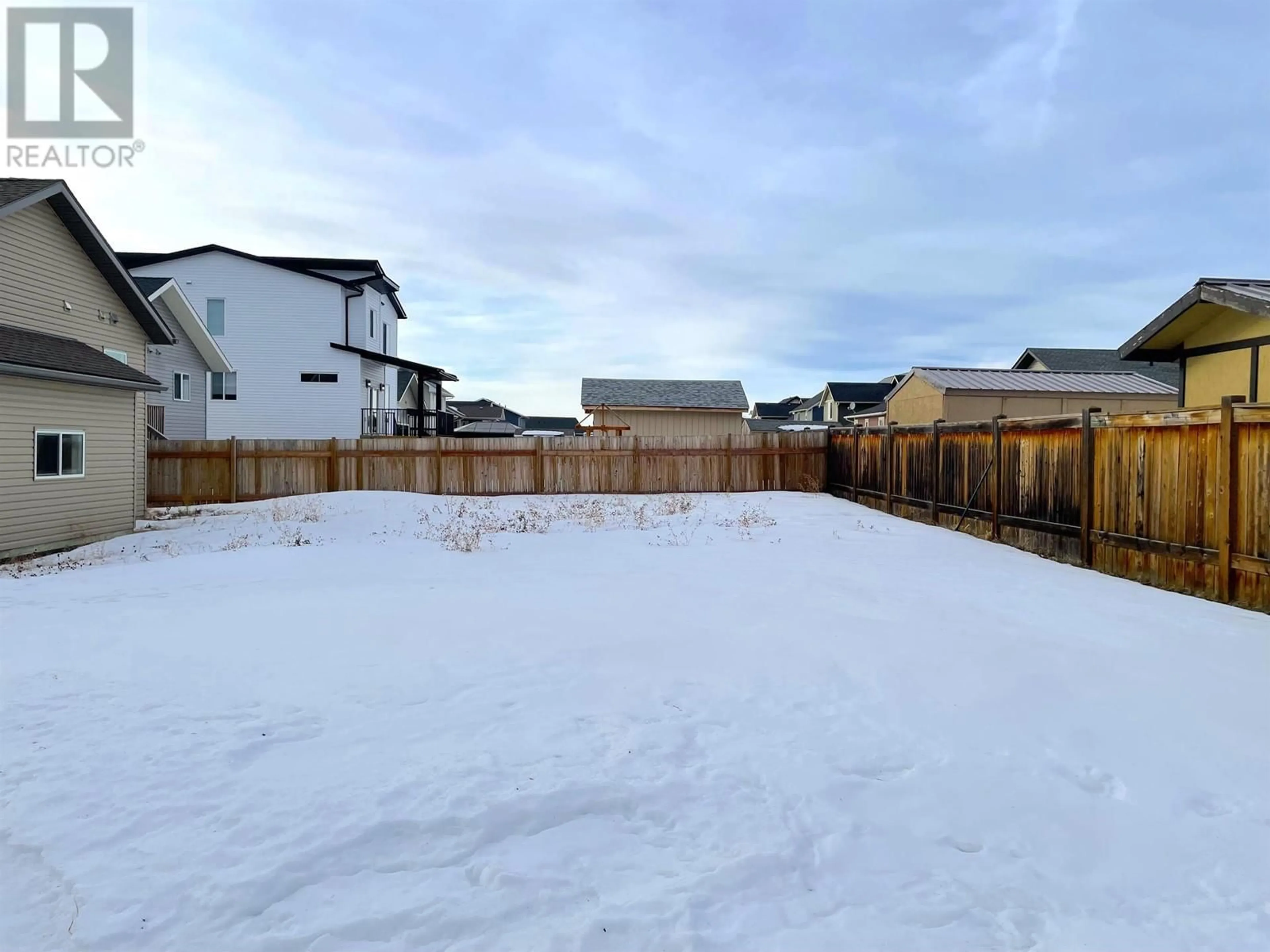 A pic from outside/outdoor area/front of a property/back of a property/a pic from drone, unknown for 8308 85 AVENUE, Fort St. John British Columbia V1J0G3