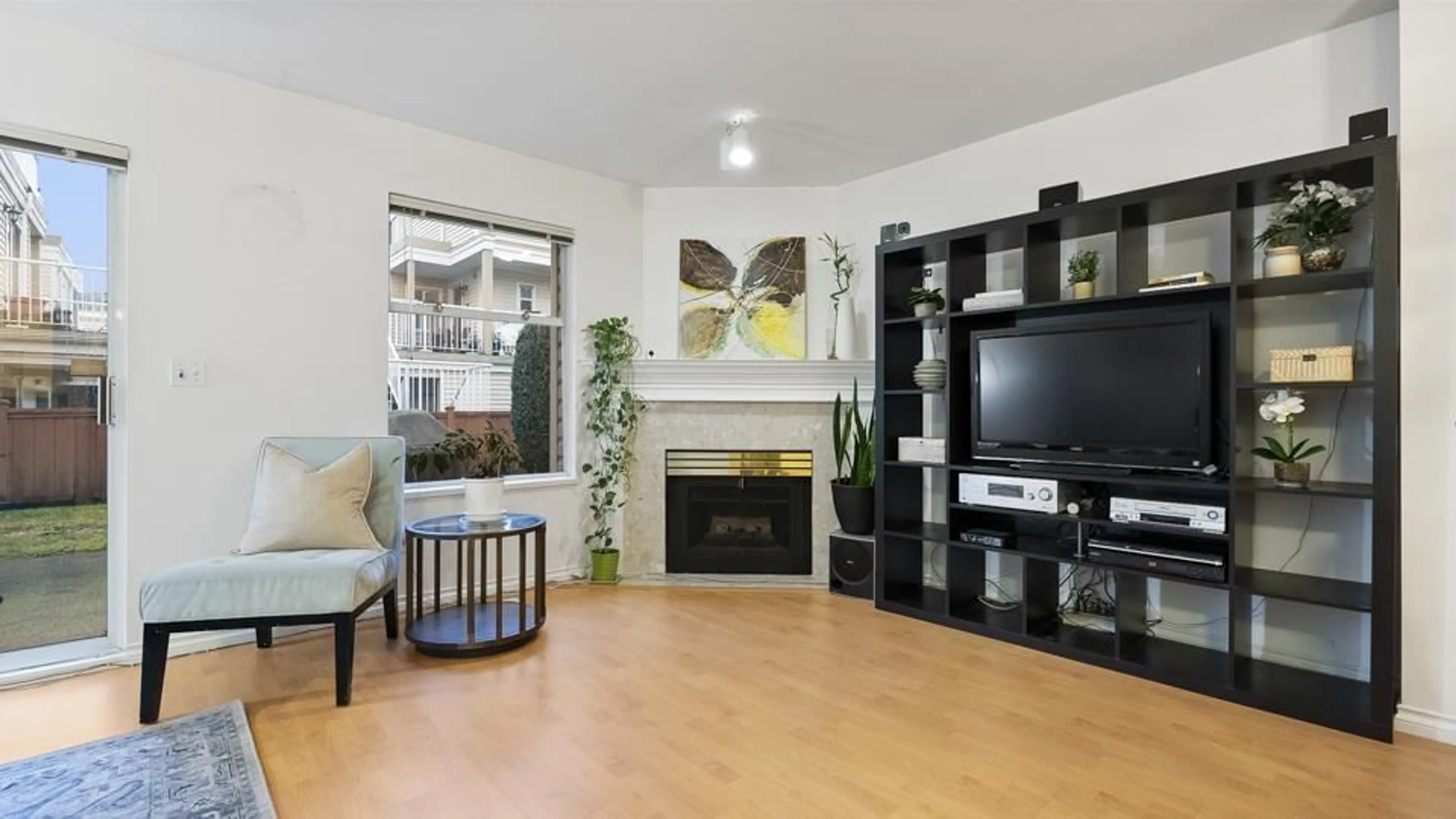 Living room with furniture, wood/laminate floor for 61 10038 155TH STREET, Surrey British Columbia V3R0S2