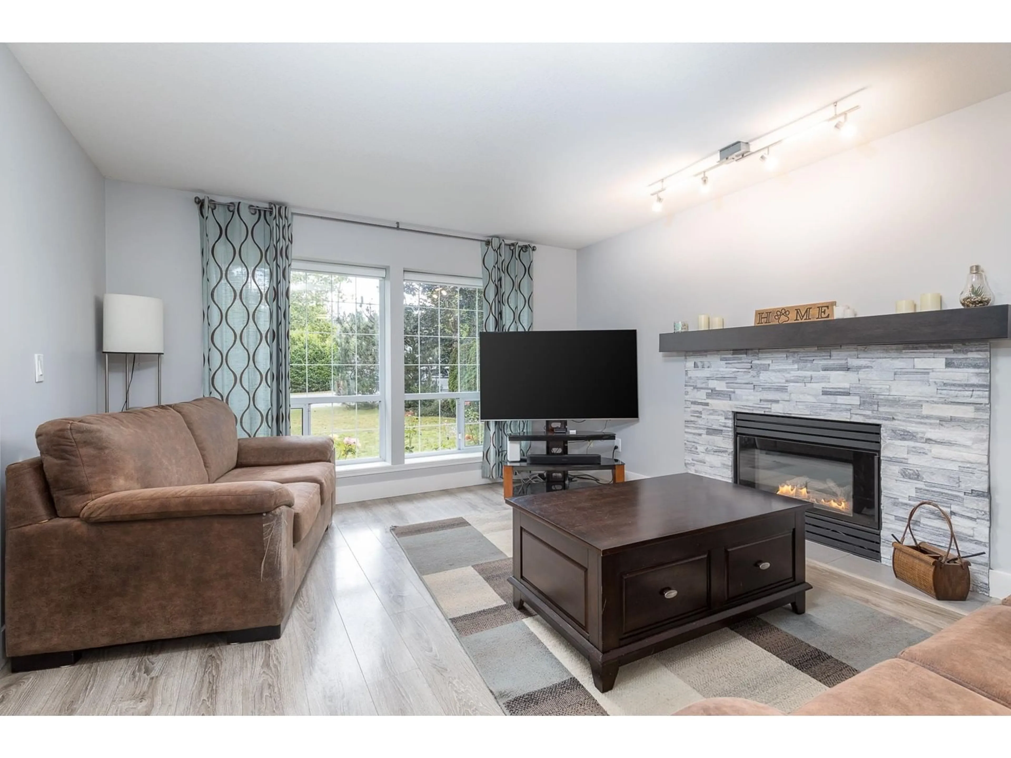 Living room with furniture, wood/laminate floor for 27103 26 AVENUE, Langley British Columbia V4W2Y7