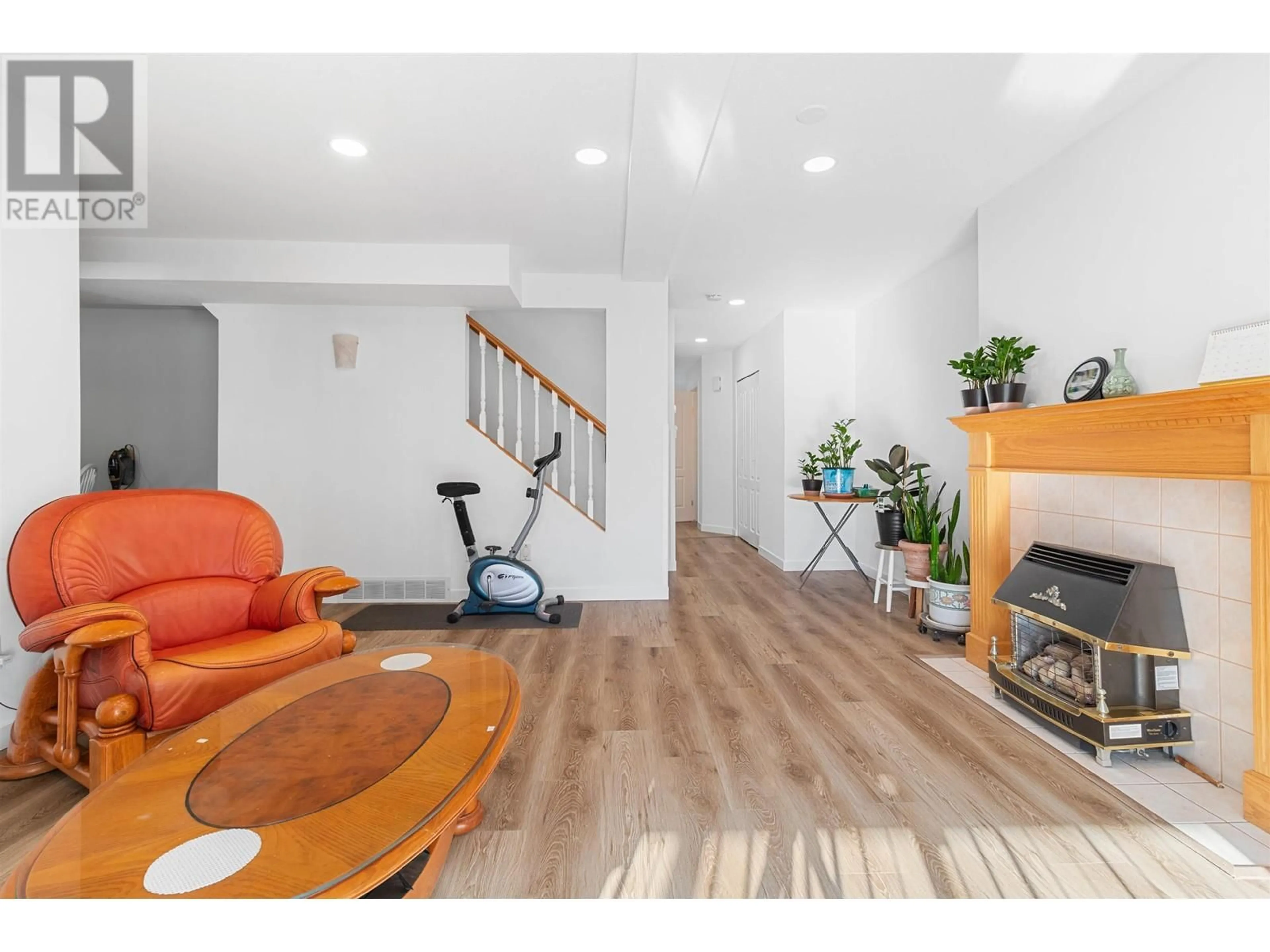 Living room with furniture, wood/laminate floor for 22 20888 MCKINNEY AVENUE, Maple Ridge British Columbia V2X0L7