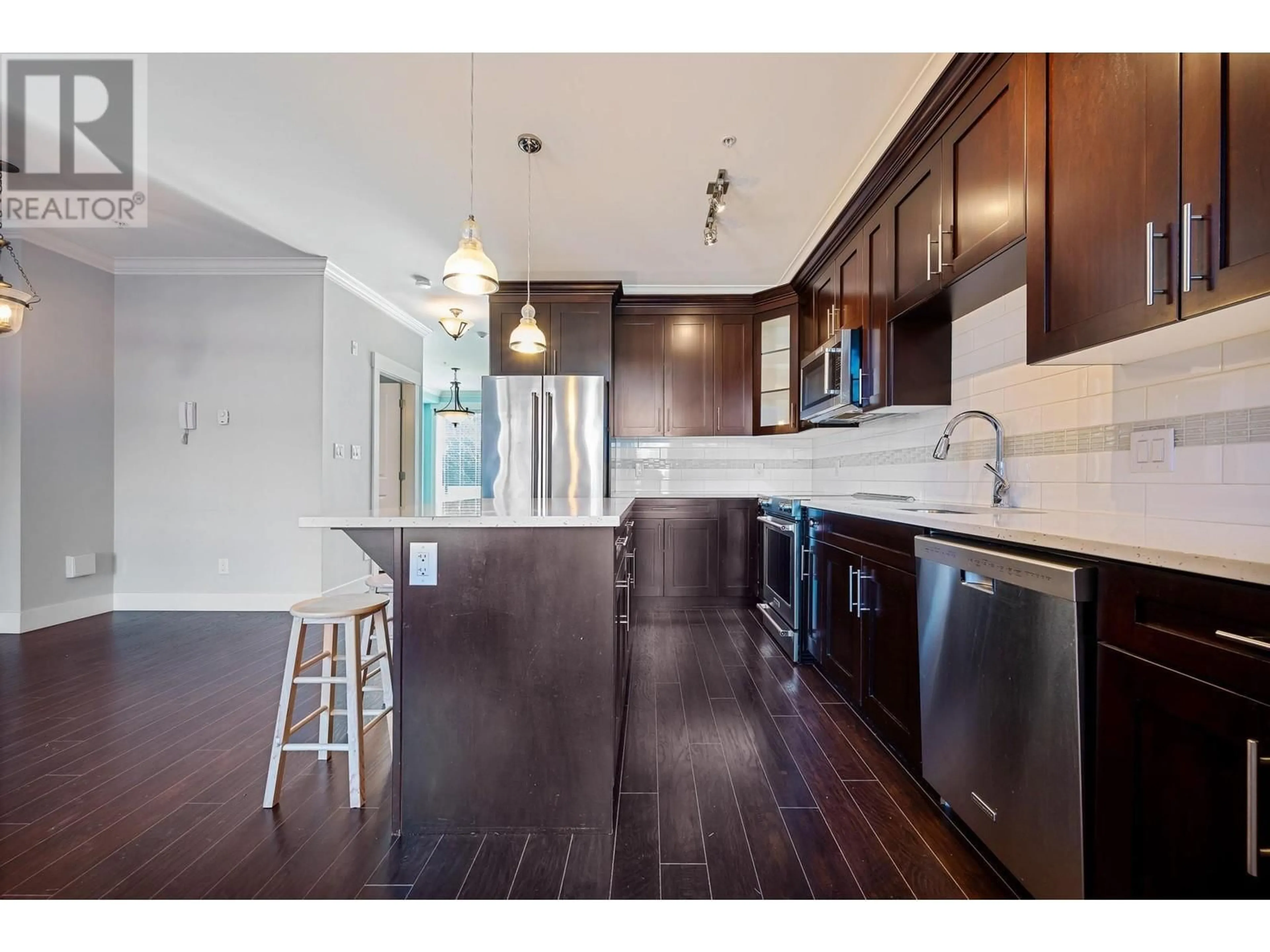 Open concept kitchen, wood/laminate floor for 10 1731 PRAIRIE AVENUE, Port Coquitlam British Columbia V3B0K5