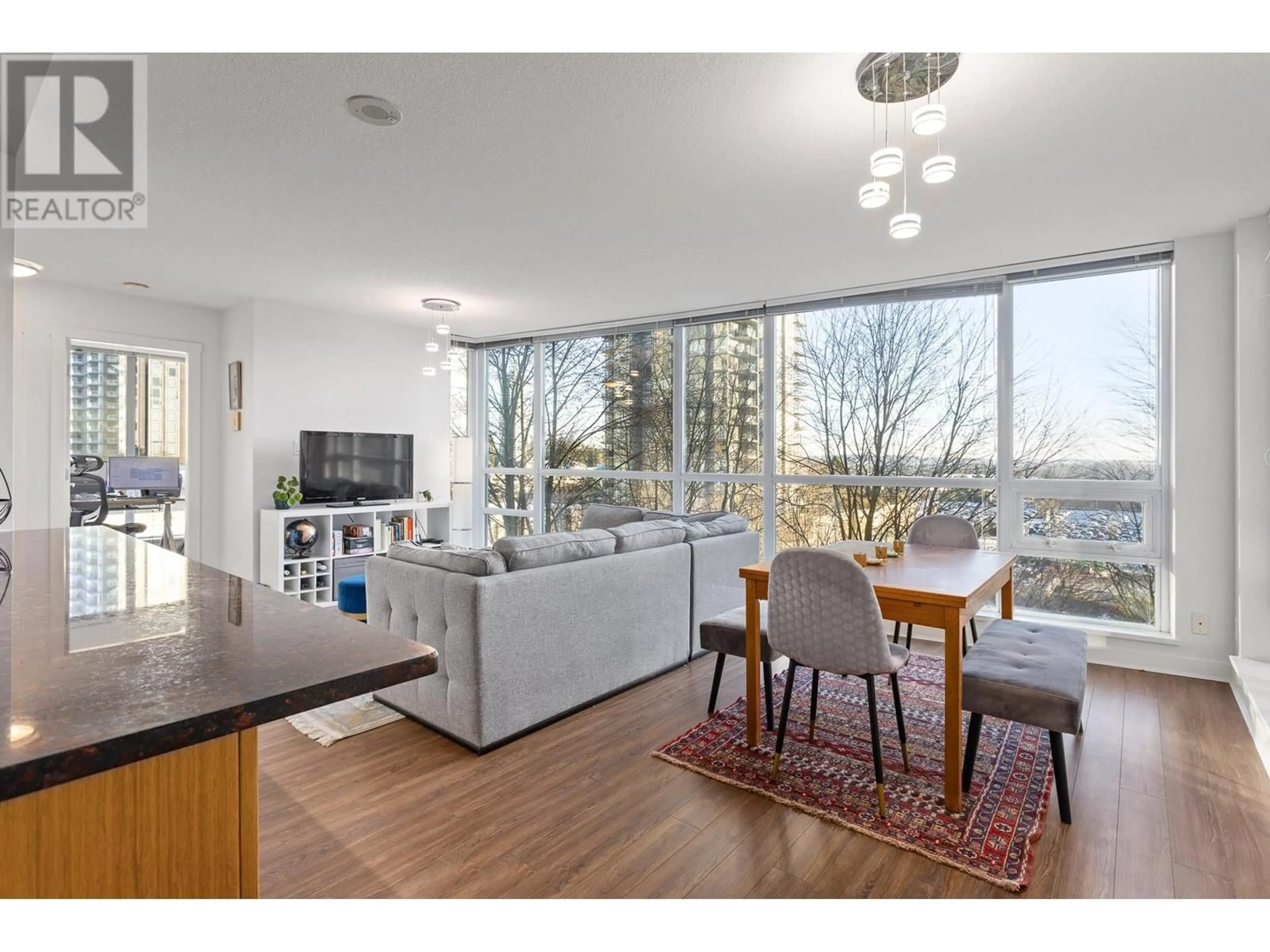 Living room with furniture, wood/laminate floor for 805 2978 GLEN DRIVE, Coquitlam British Columbia V3B0C3