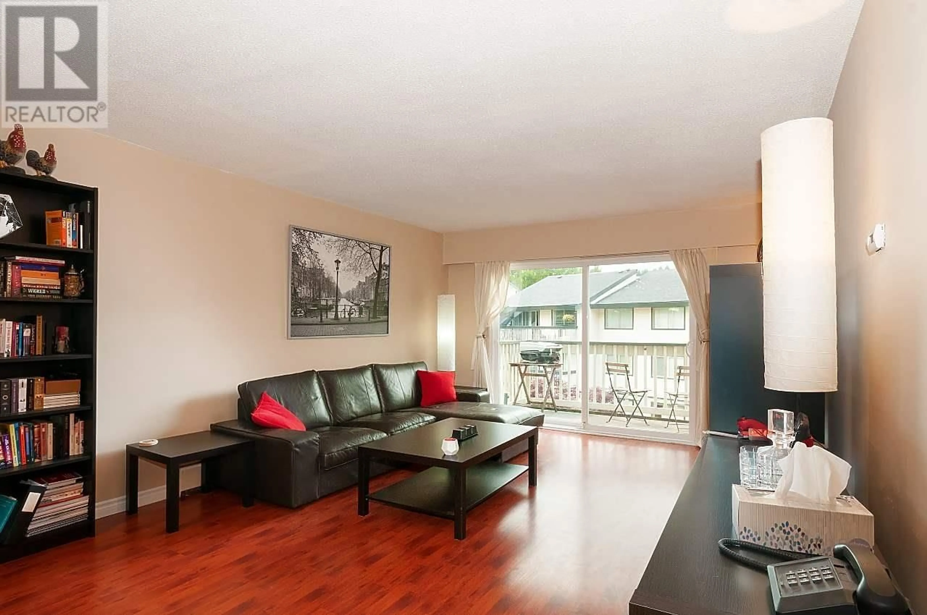 Living room with furniture, wood/laminate floor for 314 - 780 PREMIER STREET, North Vancouver British Columbia V7J2G8