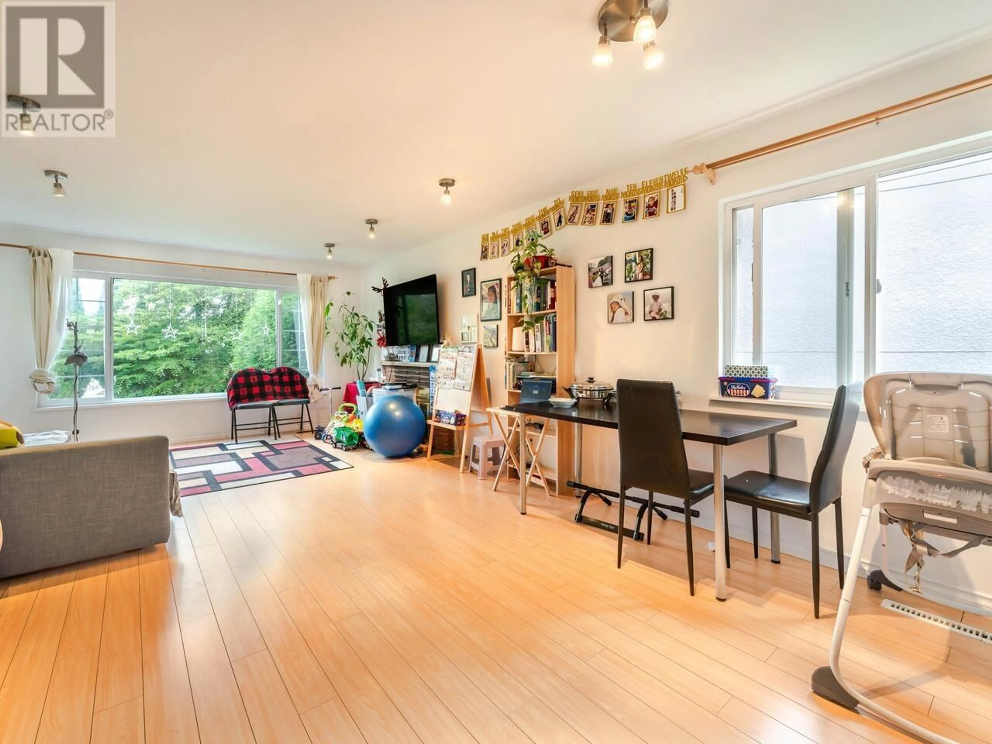 Living room with furniture, wood/laminate floor for 2216 41ST AVENUE, Vancouver British Columbia V5P1L6