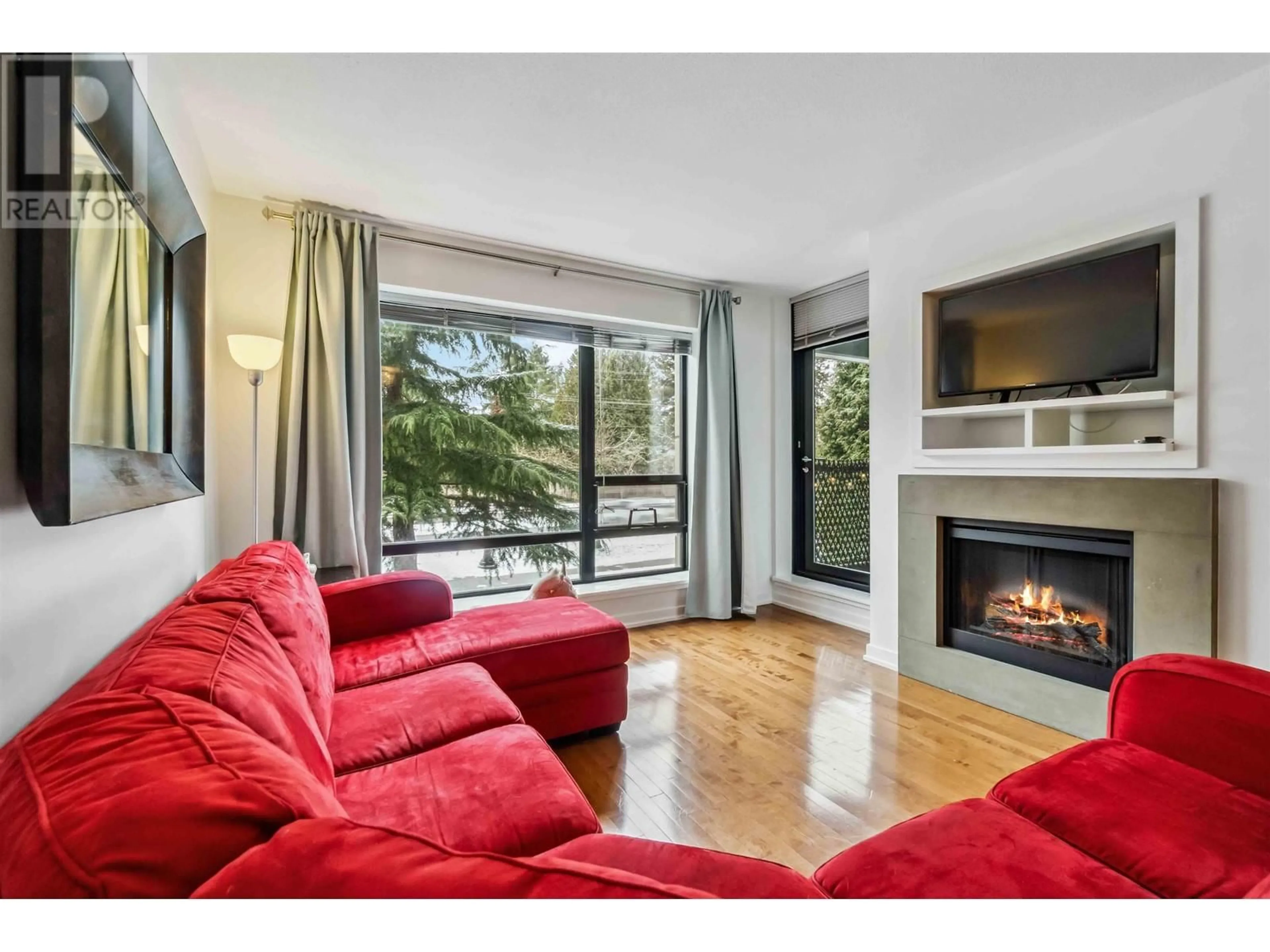 Living room with furniture, wood/laminate floor for 205 9188 HEMLOCK DRIVE, Richmond British Columbia V6Y4J7