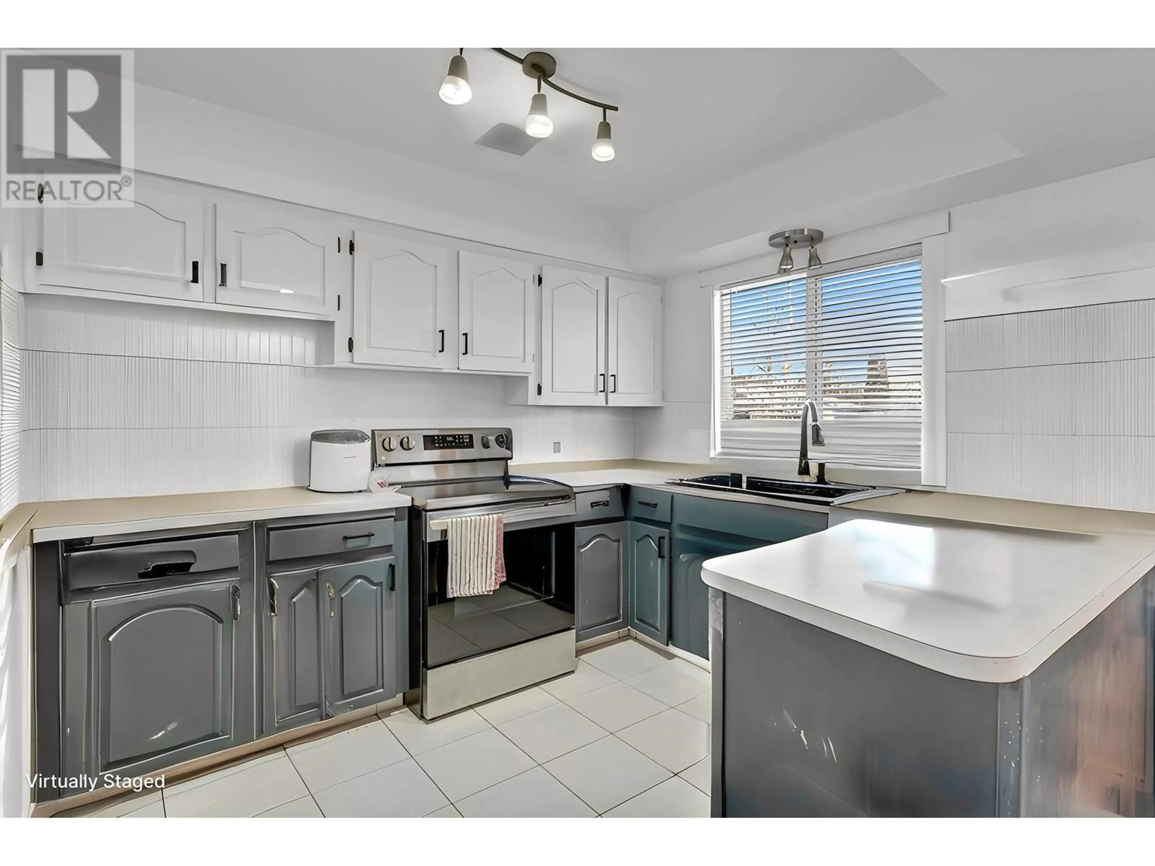 Open concept kitchen, ceramic/tile floor for 105 KELLY STREET, Prince George British Columbia V2M3J9