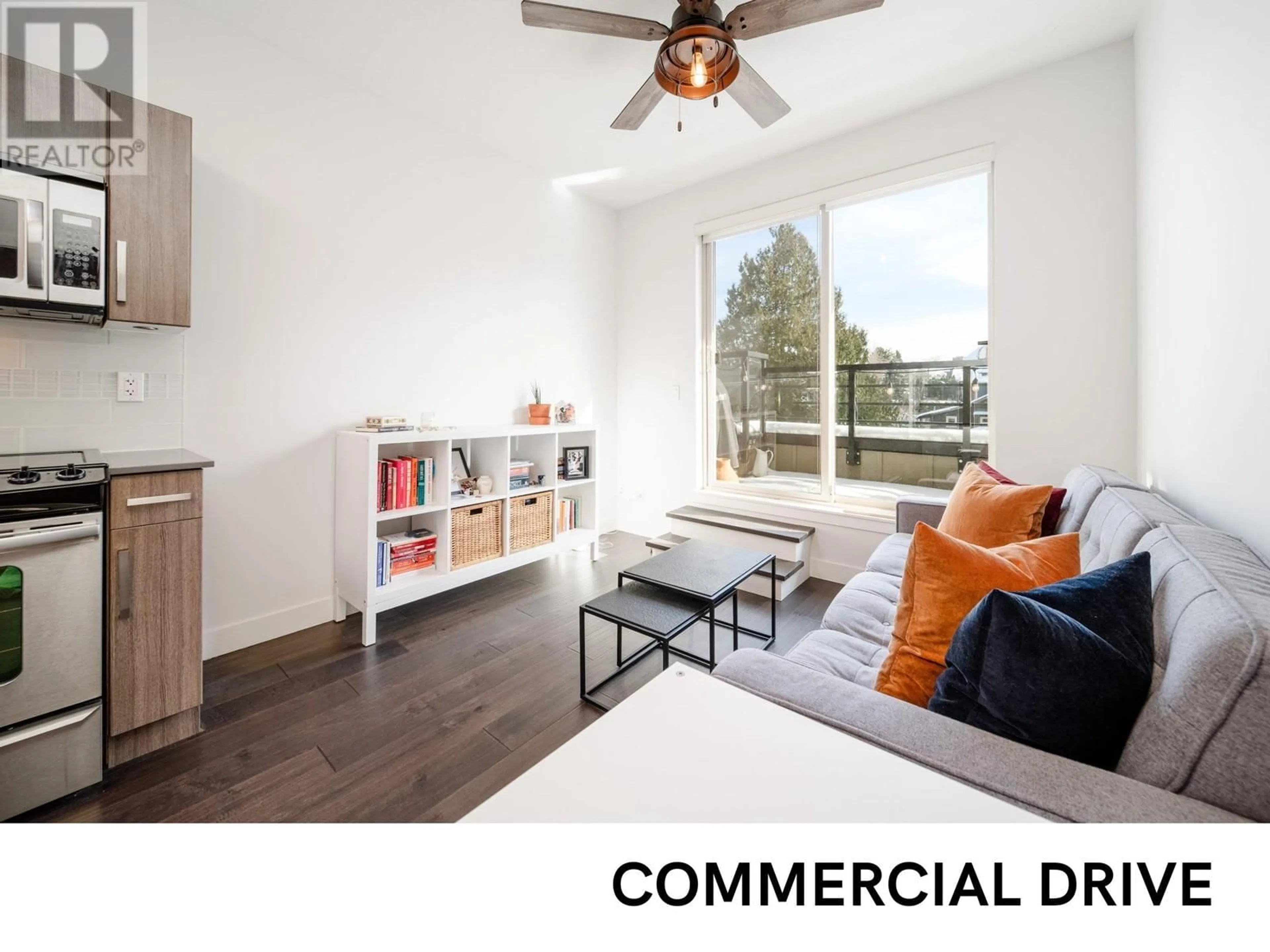 Living room with furniture, wood/laminate floor for PH2 885 SALSBURY DRIVE, Vancouver British Columbia V5L4A3