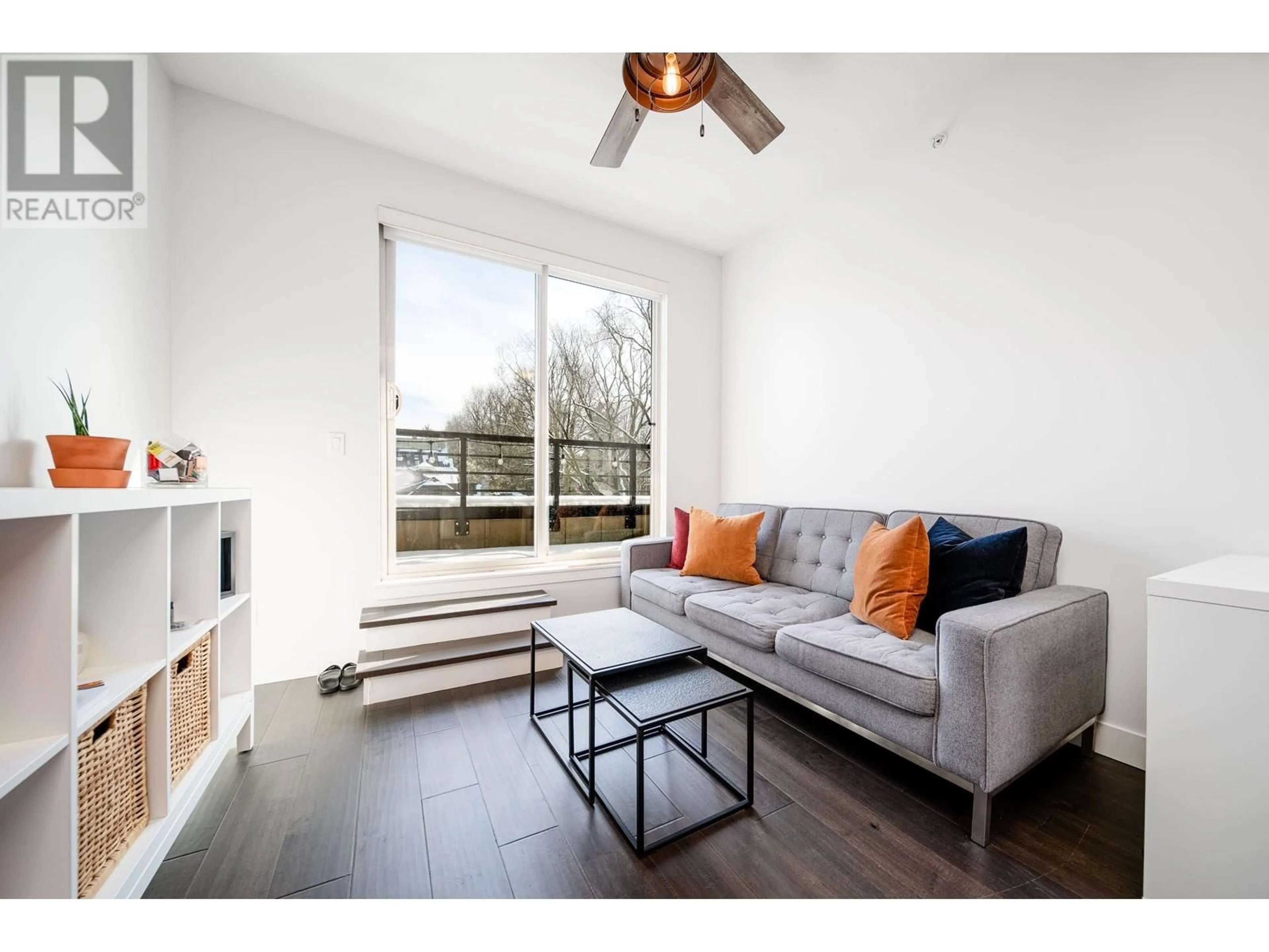 Living room with furniture, wood/laminate floor for PH2 885 SALSBURY DRIVE, Vancouver British Columbia V5L4A3