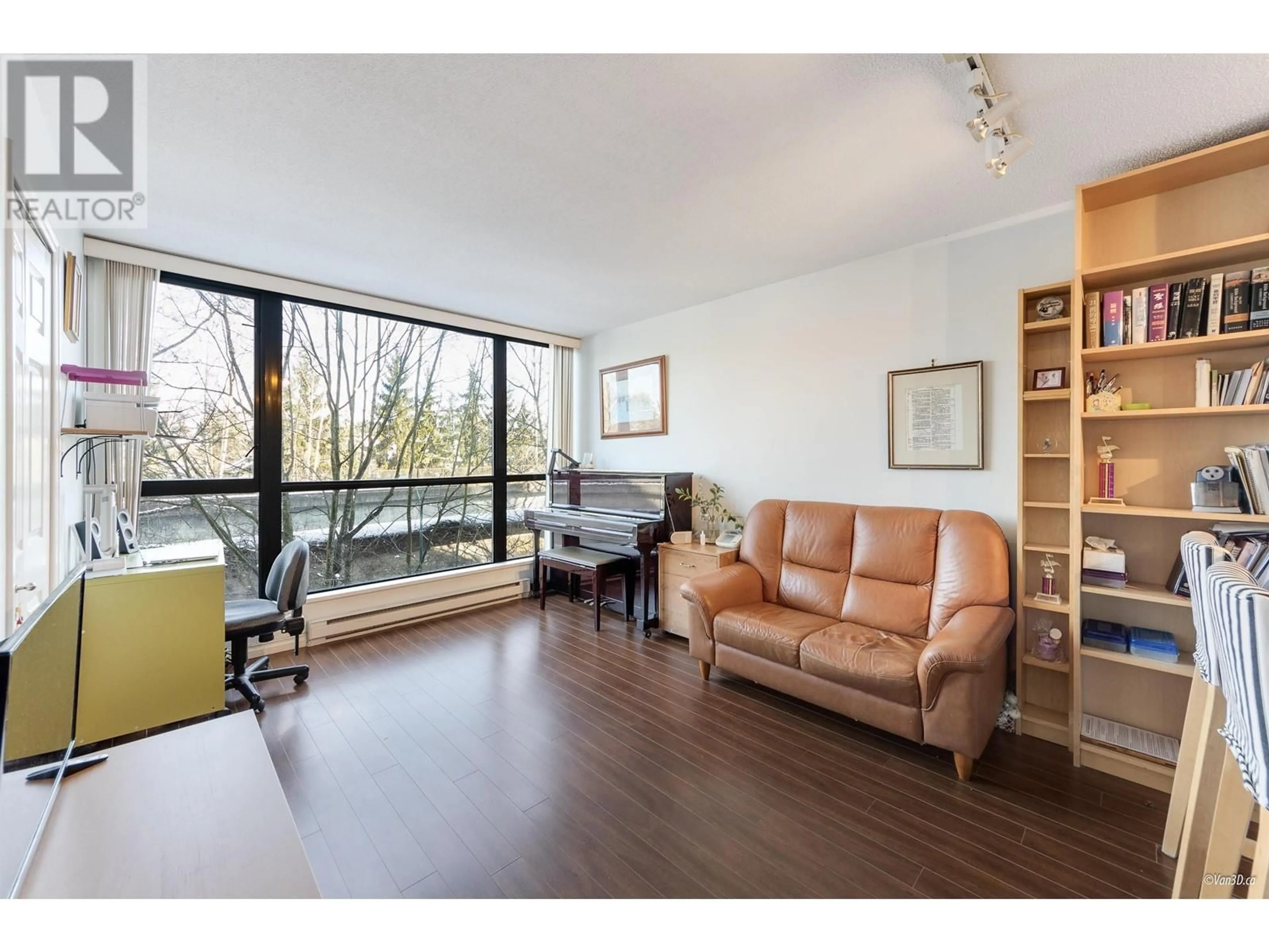 Living room with furniture, wood/laminate floor for 414 3588 VANNESS AVENUE, Vancouver British Columbia V5R6E9