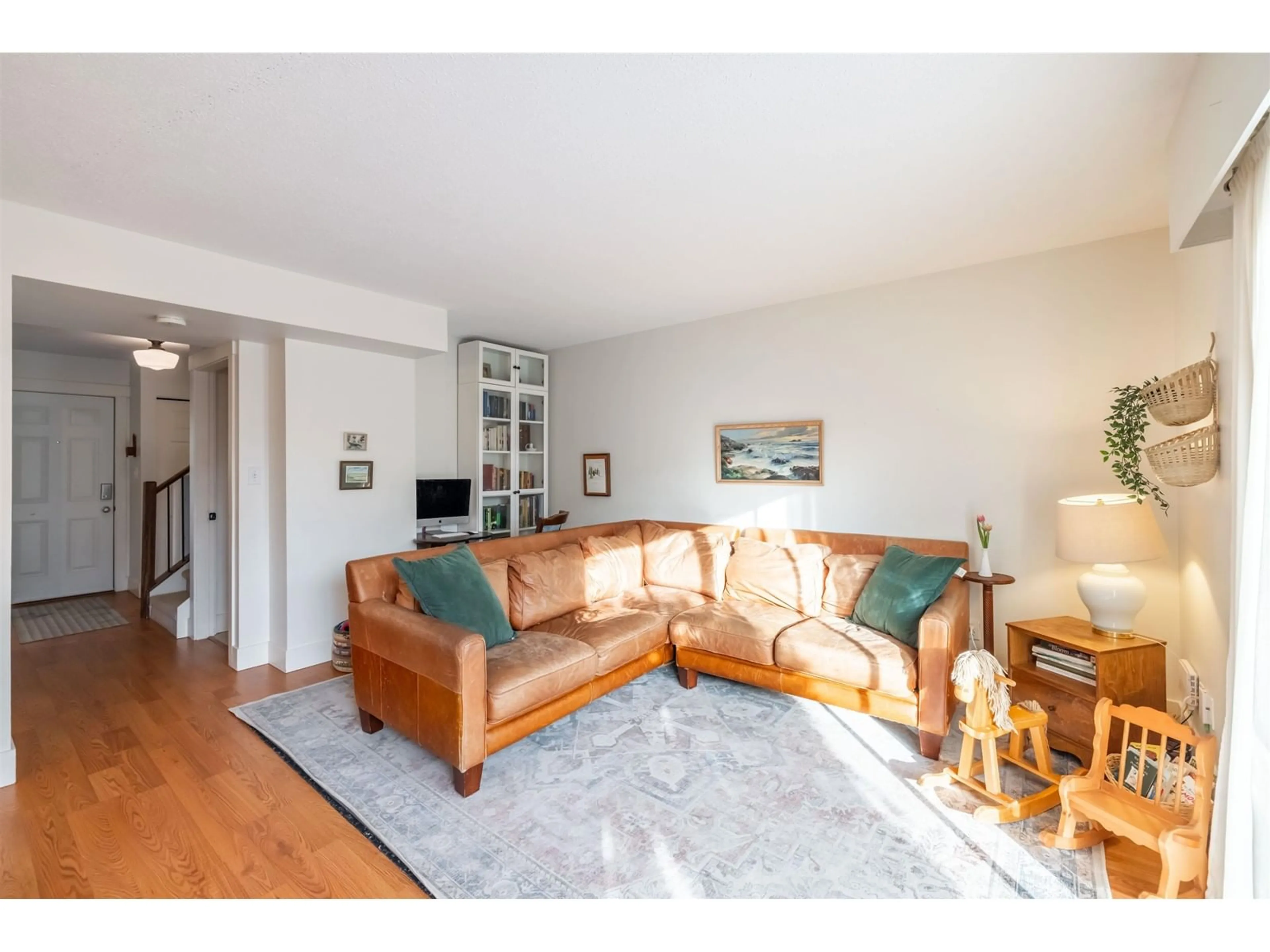 Living room with furniture, wood/laminate floor for 108 32880 BEVAN WAY, Abbotsford British Columbia V2S6R3