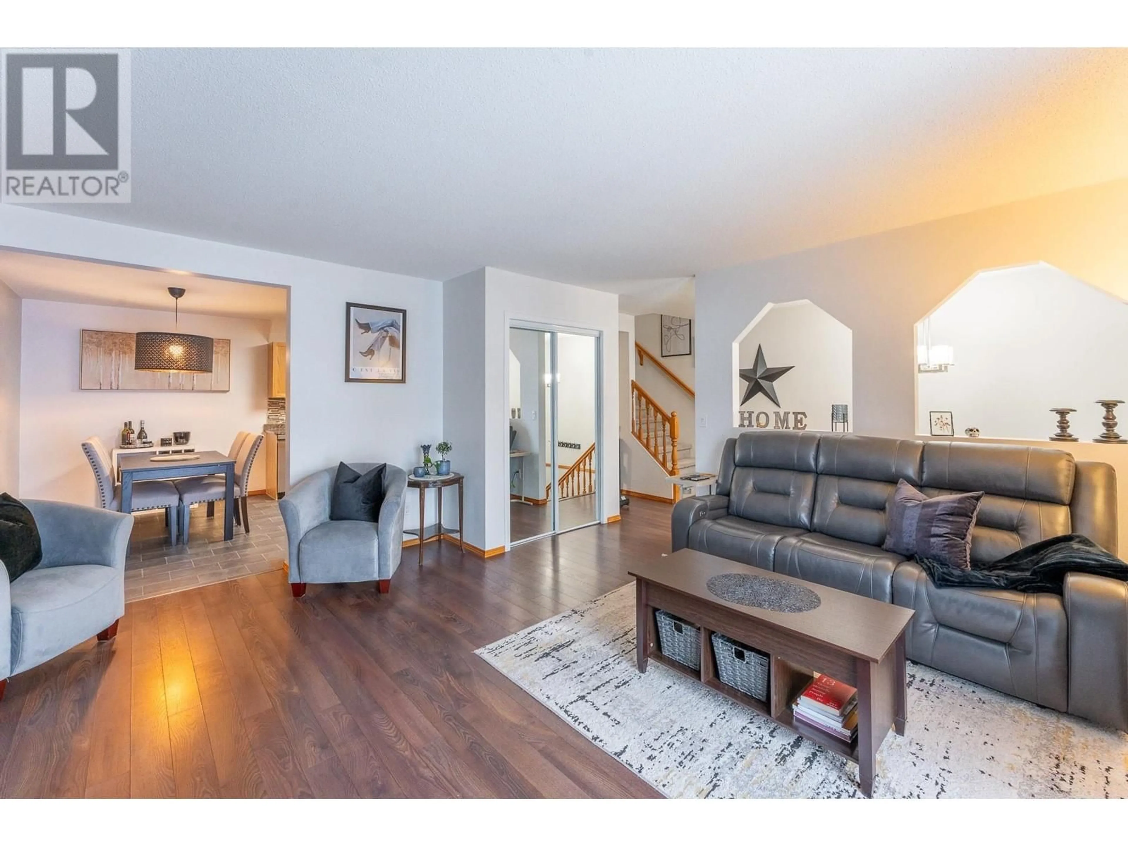 Living room with furniture, wood/laminate floor for 106 3015 ST ANNE CRESCENT, Prince George British Columbia V2N5C7