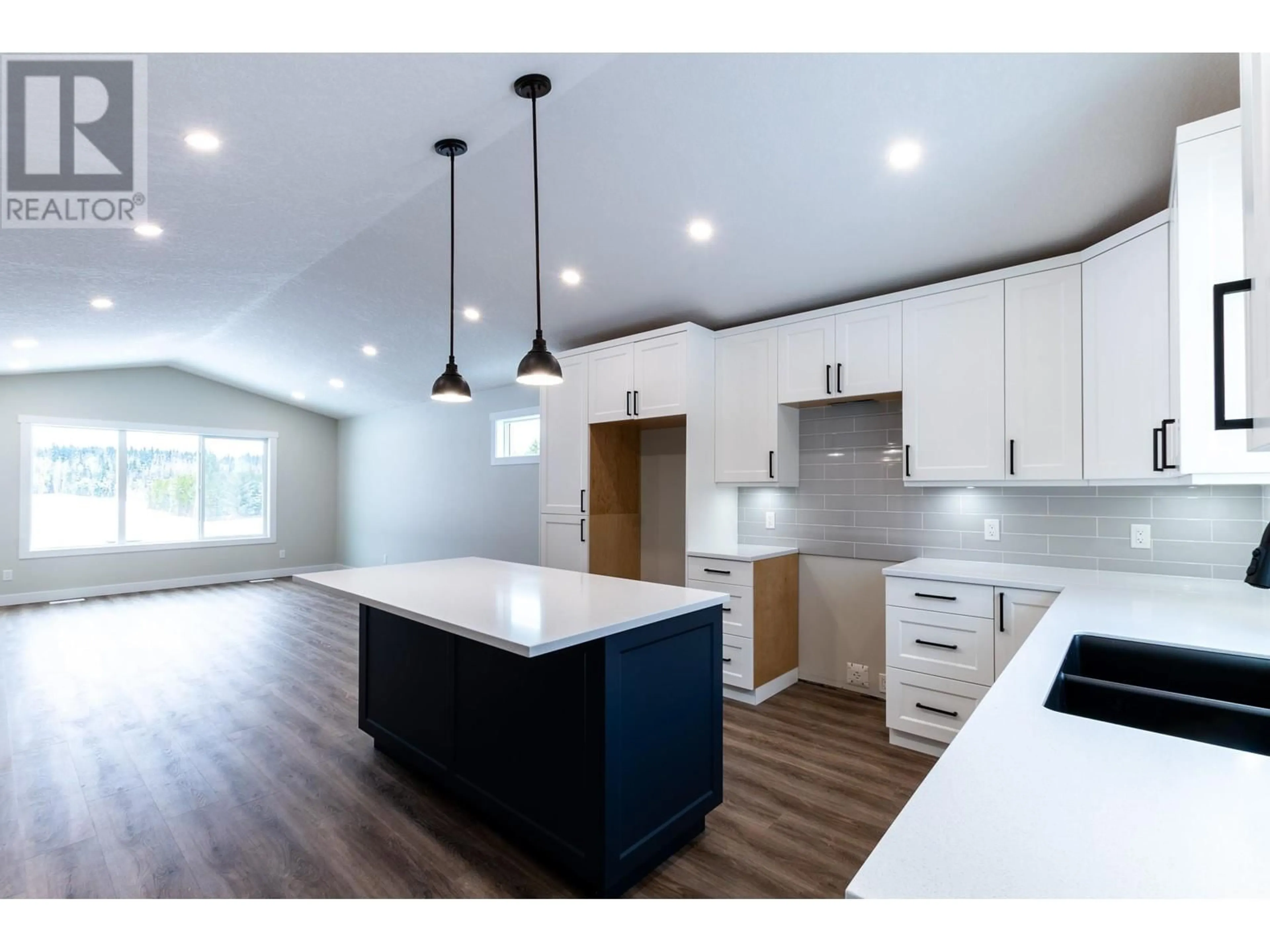 Open concept kitchen, wood/laminate floor for 7220 HILLU ROAD, Prince George British Columbia V2K0B4