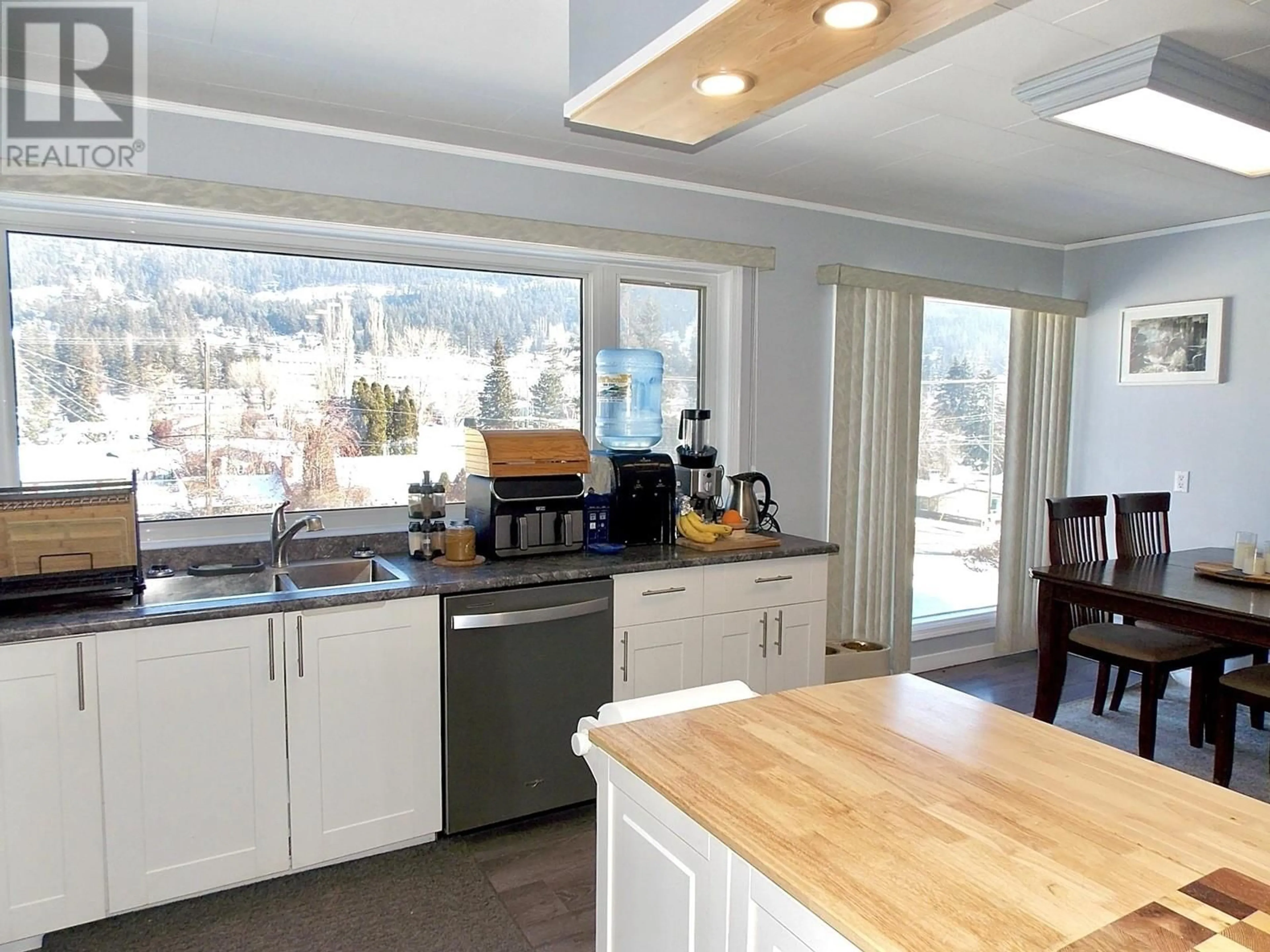 Open concept kitchen, wood/laminate floor for 711 WESTERN AVENUE, Williams Lake British Columbia V2G2J2