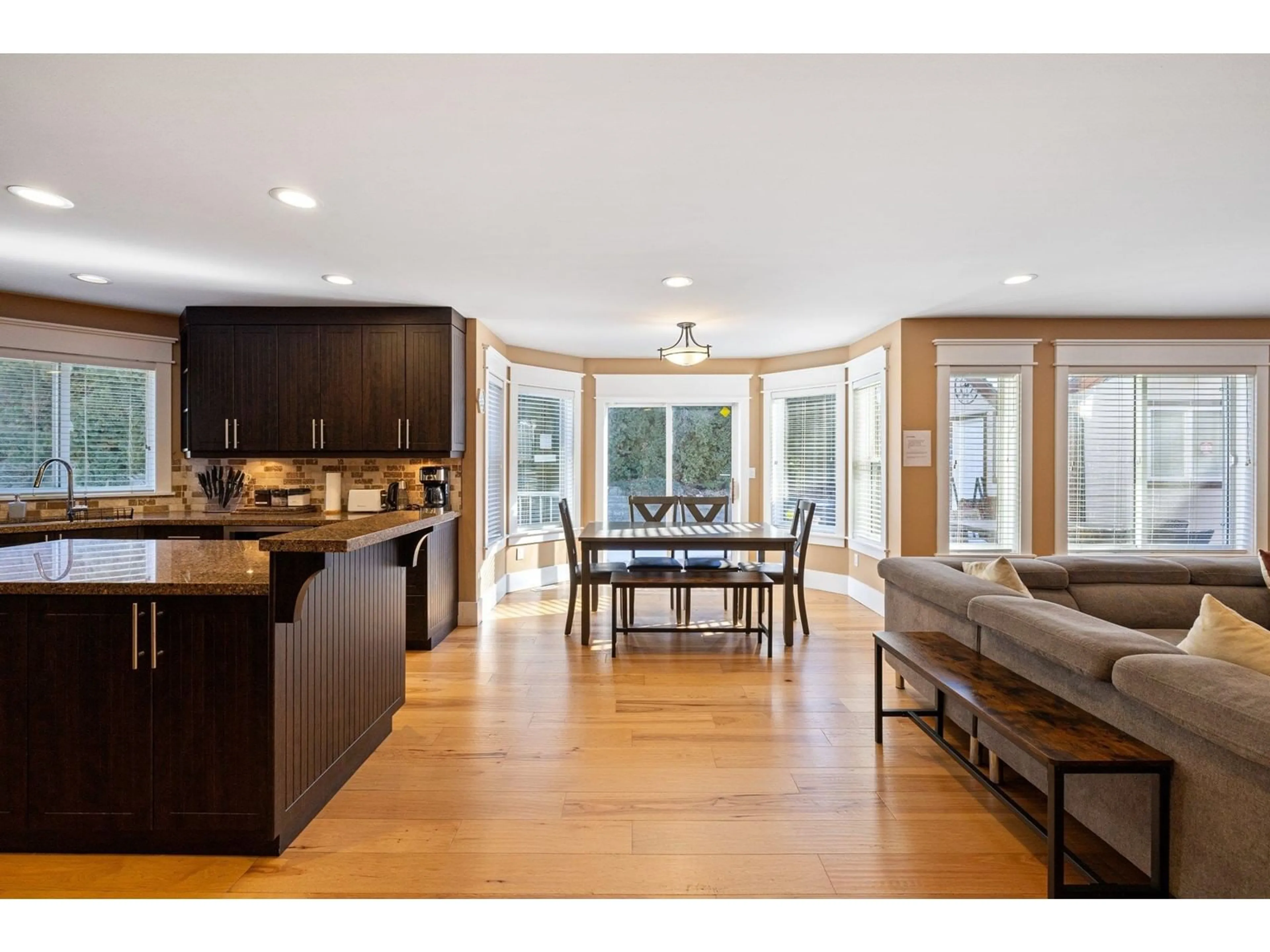 Open concept kitchen, wood/laminate floor for 15355 80A AVENUE, Surrey British Columbia V3S8N7