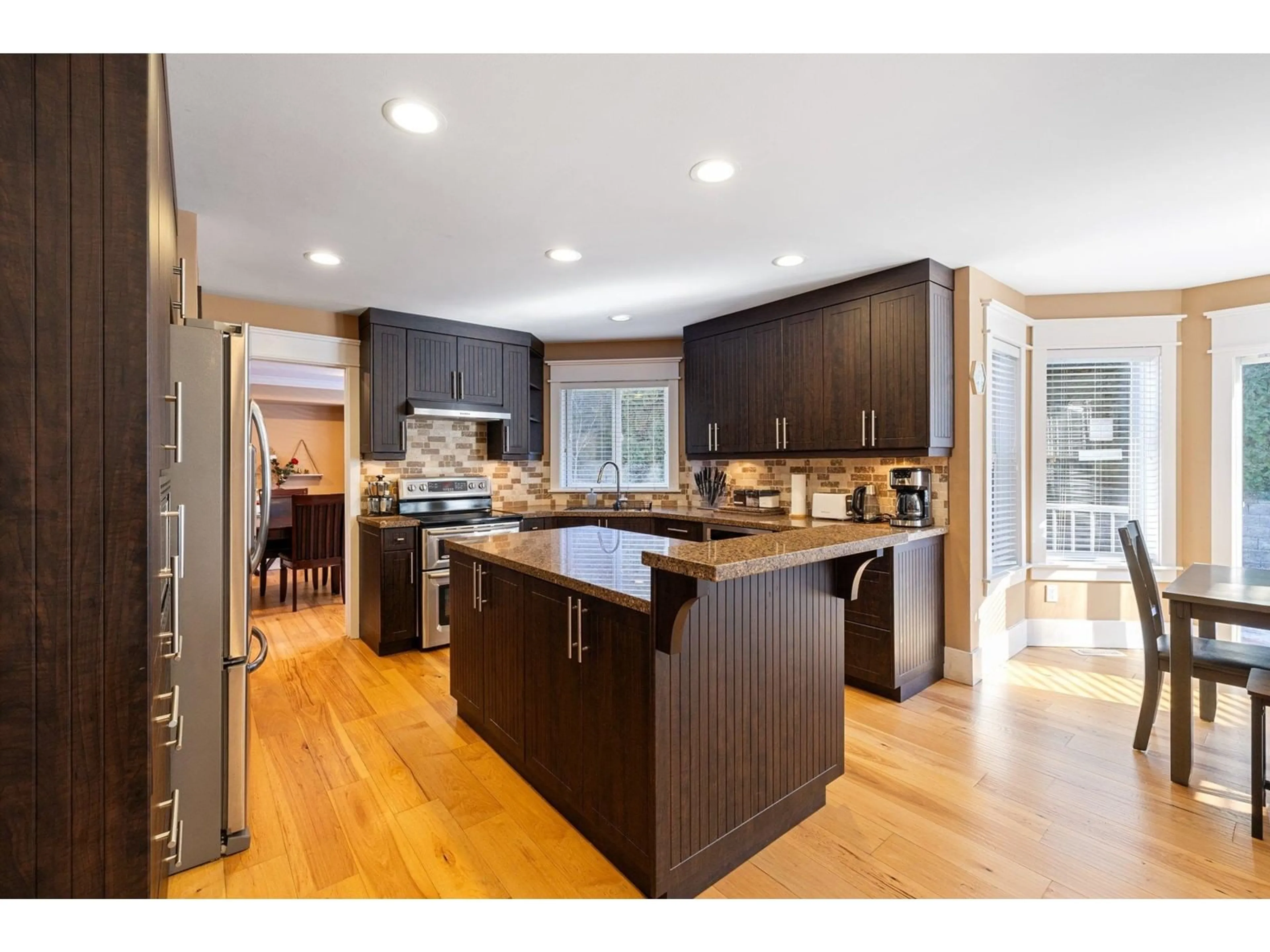 Open concept kitchen, wood/laminate floor for 15355 80A AVENUE, Surrey British Columbia V3S8N7