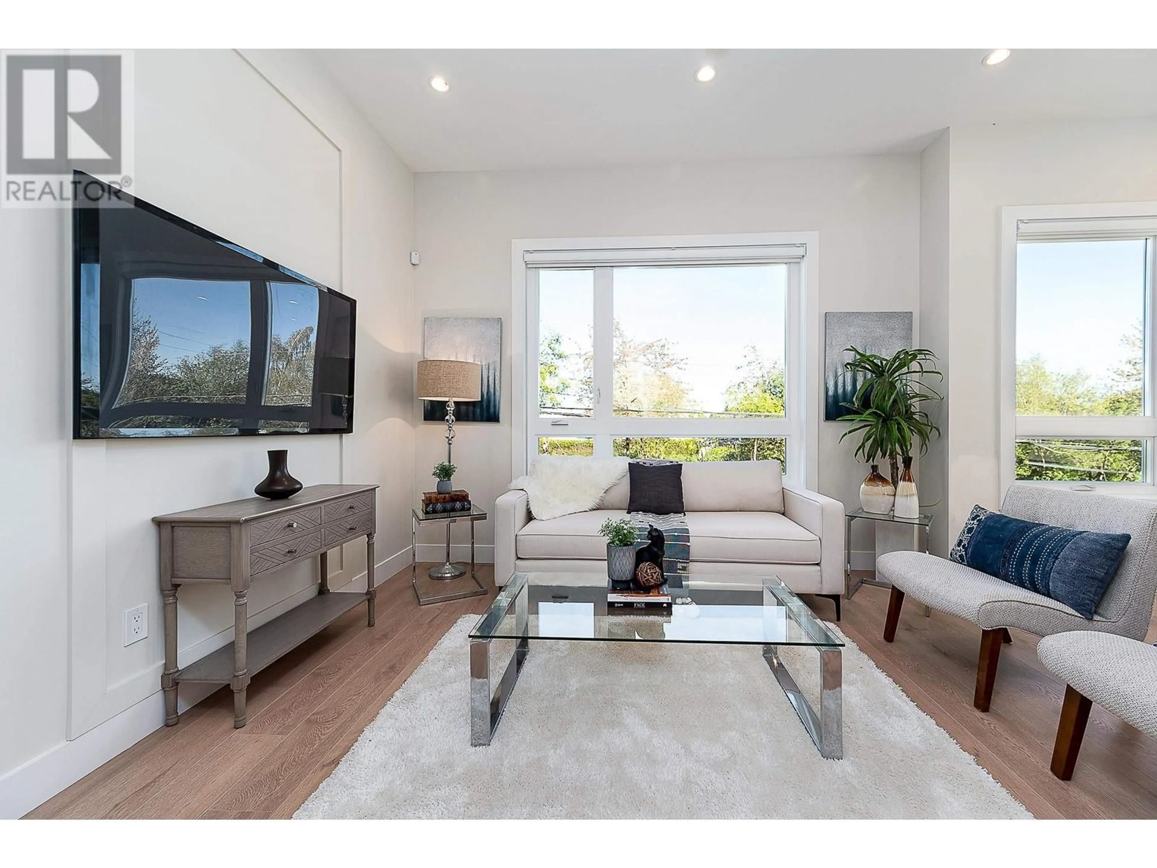 Living room with furniture, wood/laminate floor for 10 3033 SHELL ROAD, Richmond British Columbia V6X0B8