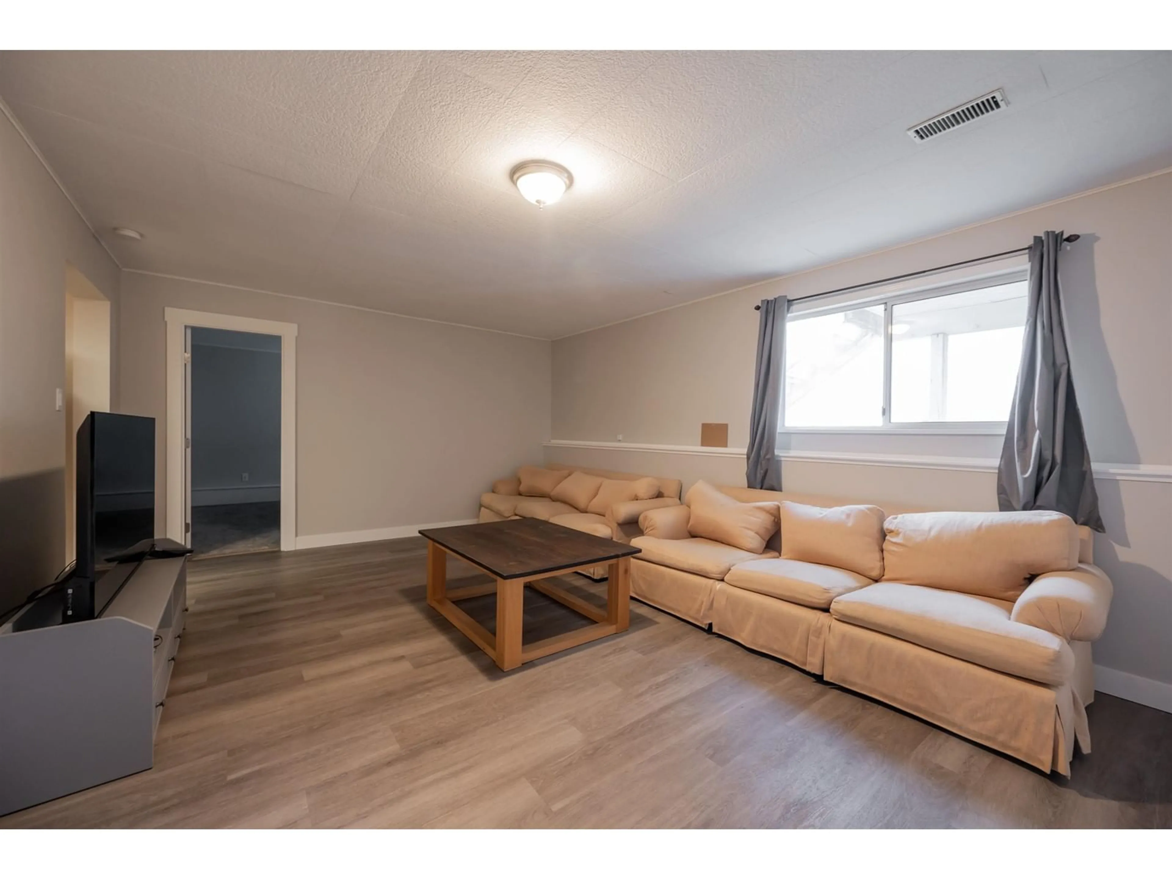 Living room with furniture, wood/laminate floor for 35088 MT BLANCHARD DRIVE, Abbotsford British Columbia V2S6T3