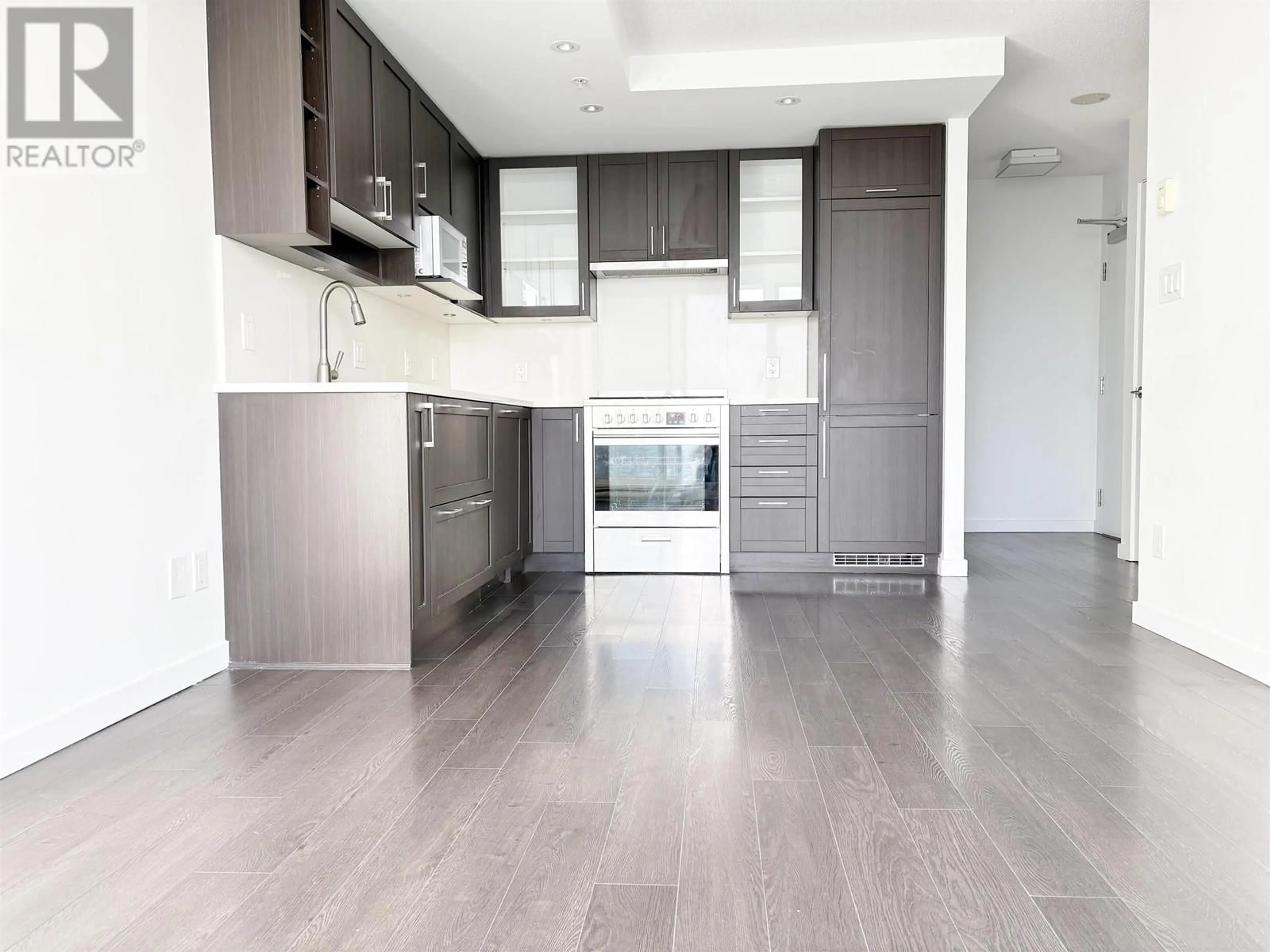 Open concept kitchen, wood/laminate floor for 3206 5665 BOUNDARY ROAD, Vancouver British Columbia V5R0E4