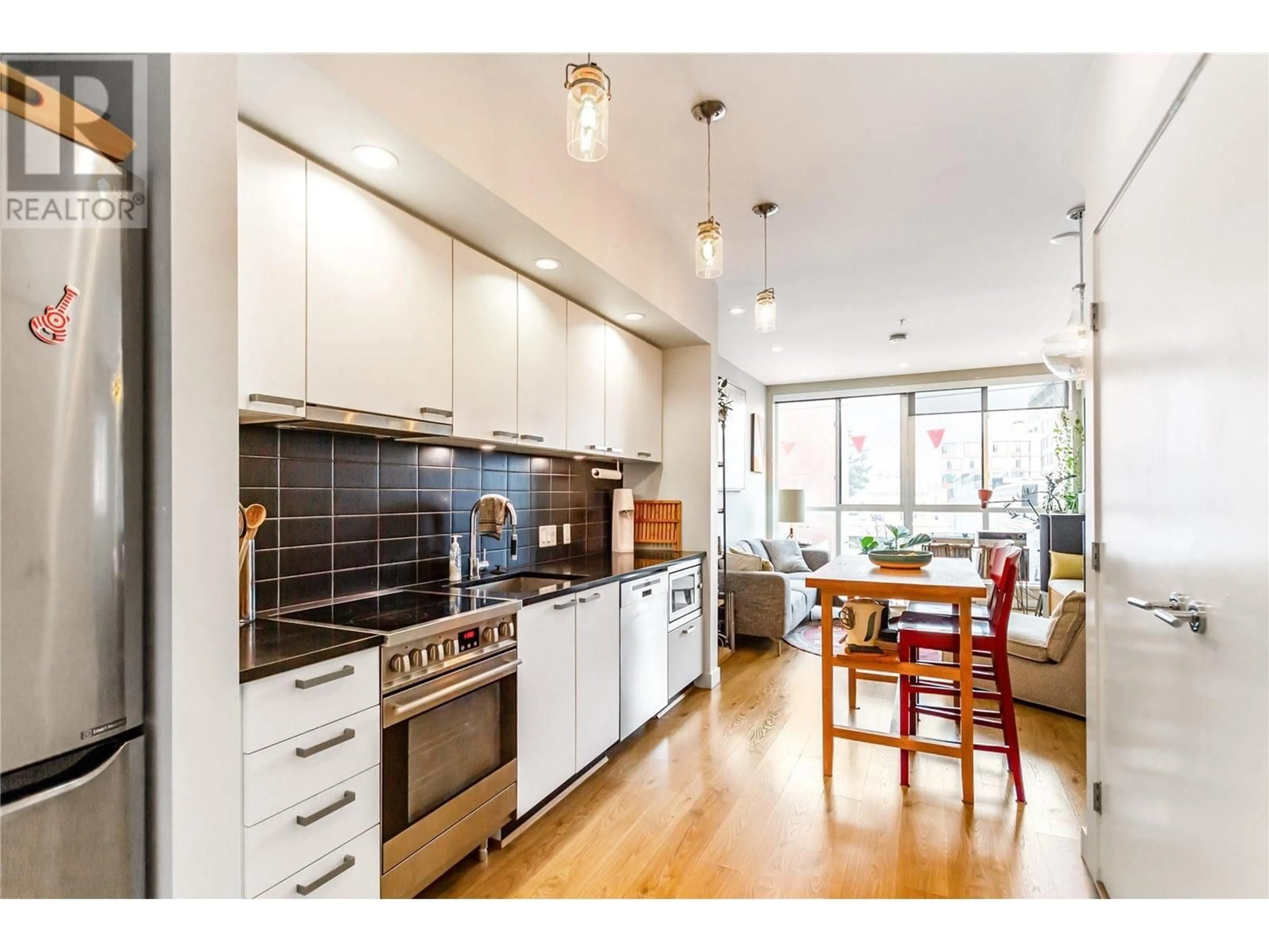 Open concept kitchen, wood/laminate floor for 304 557 E CORDOVA STREET, Vancouver British Columbia V6A1L8