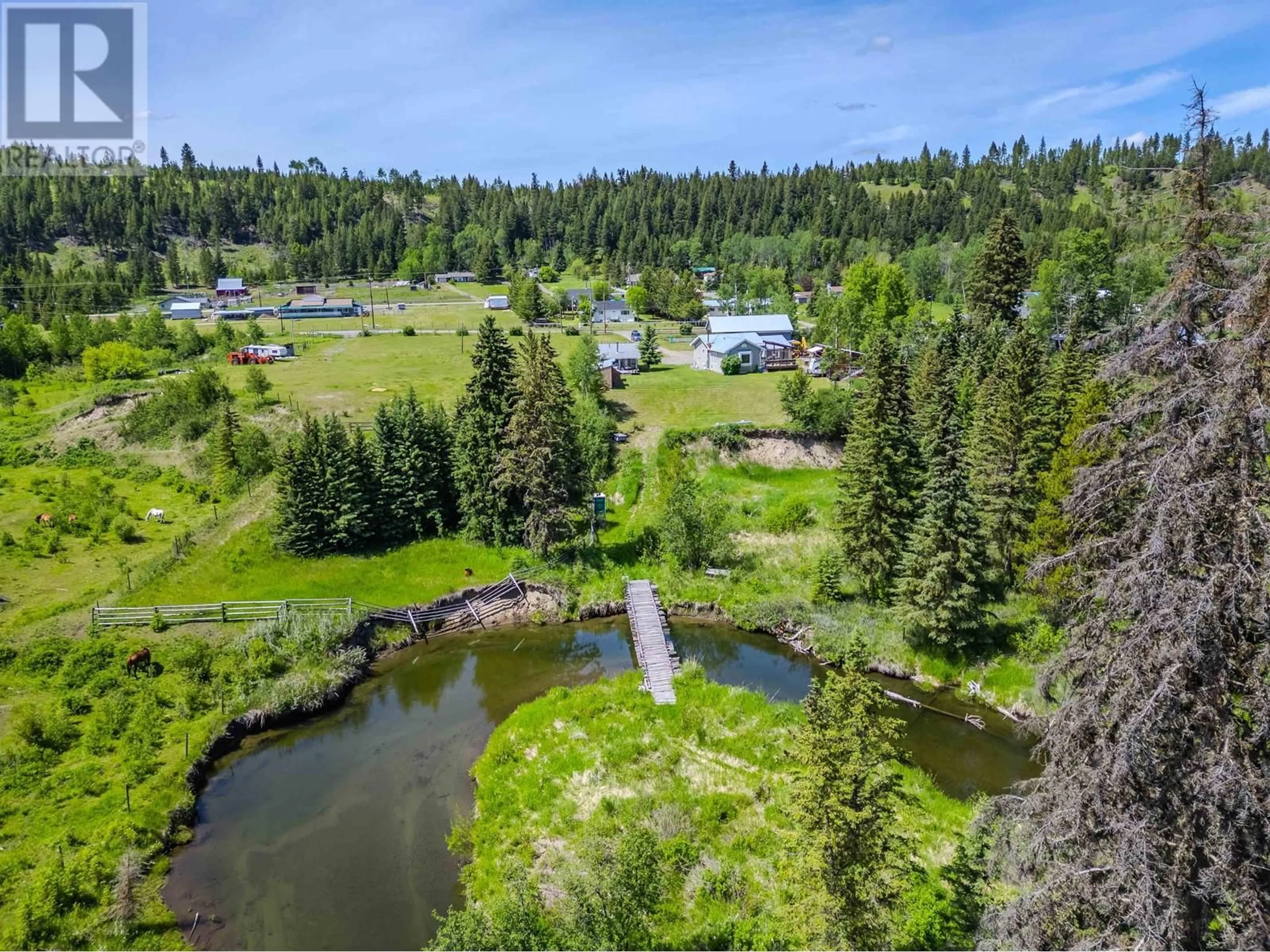 A pic from outside/outdoor area/front of a property/back of a property/a pic from drone, water/lake/river/ocean view for 5501 KENNEDY ROAD, 100 Mile House British Columbia V0K2E0