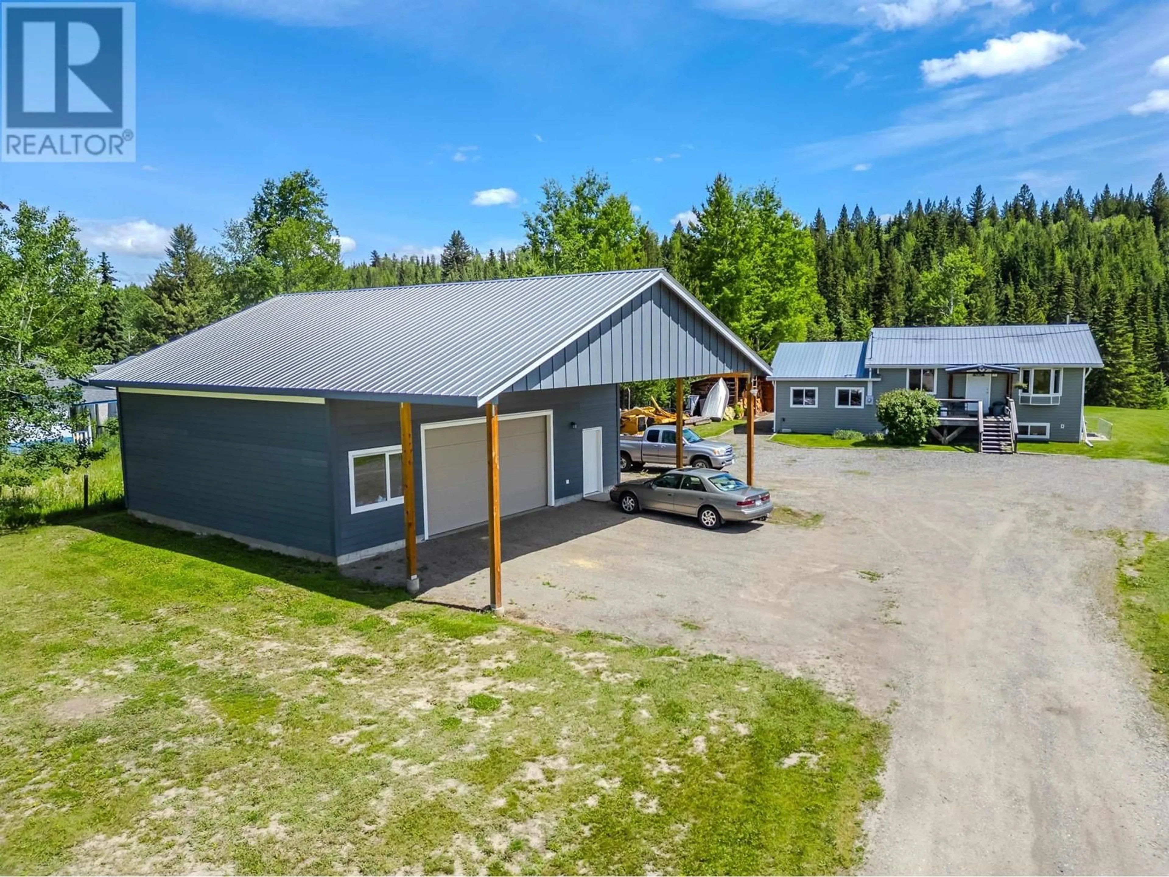 A pic from outside/outdoor area/front of a property/back of a property/a pic from drone, building for 5501 KENNEDY ROAD, 100 Mile House British Columbia V0K2E0