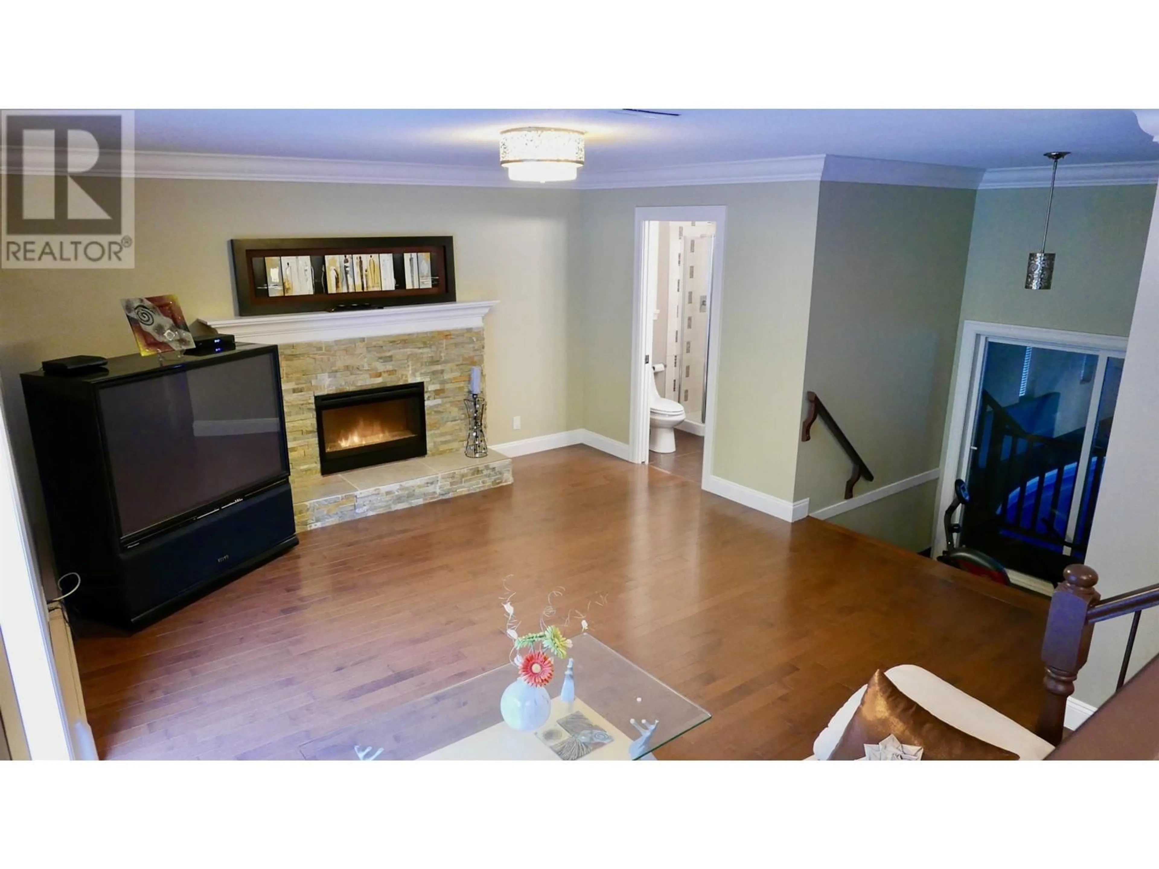 Living room with furniture, wood/laminate floor for 7625 AUBREY STREET, Burnaby British Columbia V5A1K6