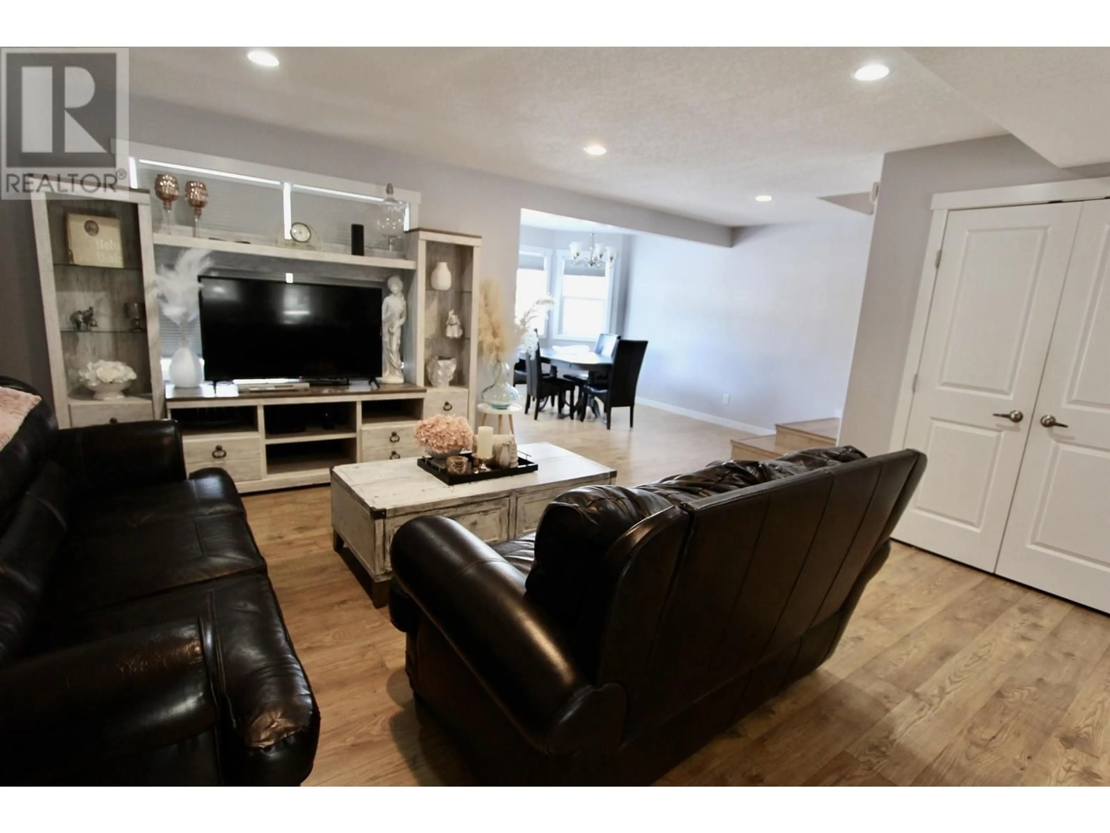 Living room with furniture, wood/laminate floor for 8029 STILLWATER CRESCENT, Prince George British Columbia V2N0C2