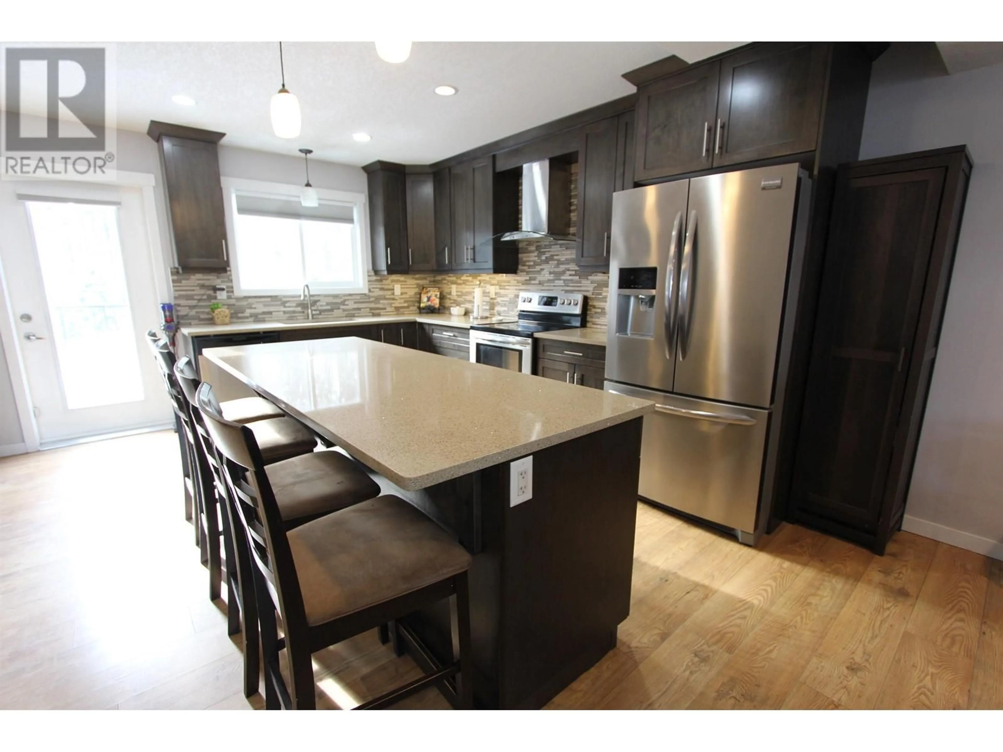 Contemporary kitchen, wood/laminate floor for 8029 STILLWATER CRESCENT, Prince George British Columbia V2N0C2